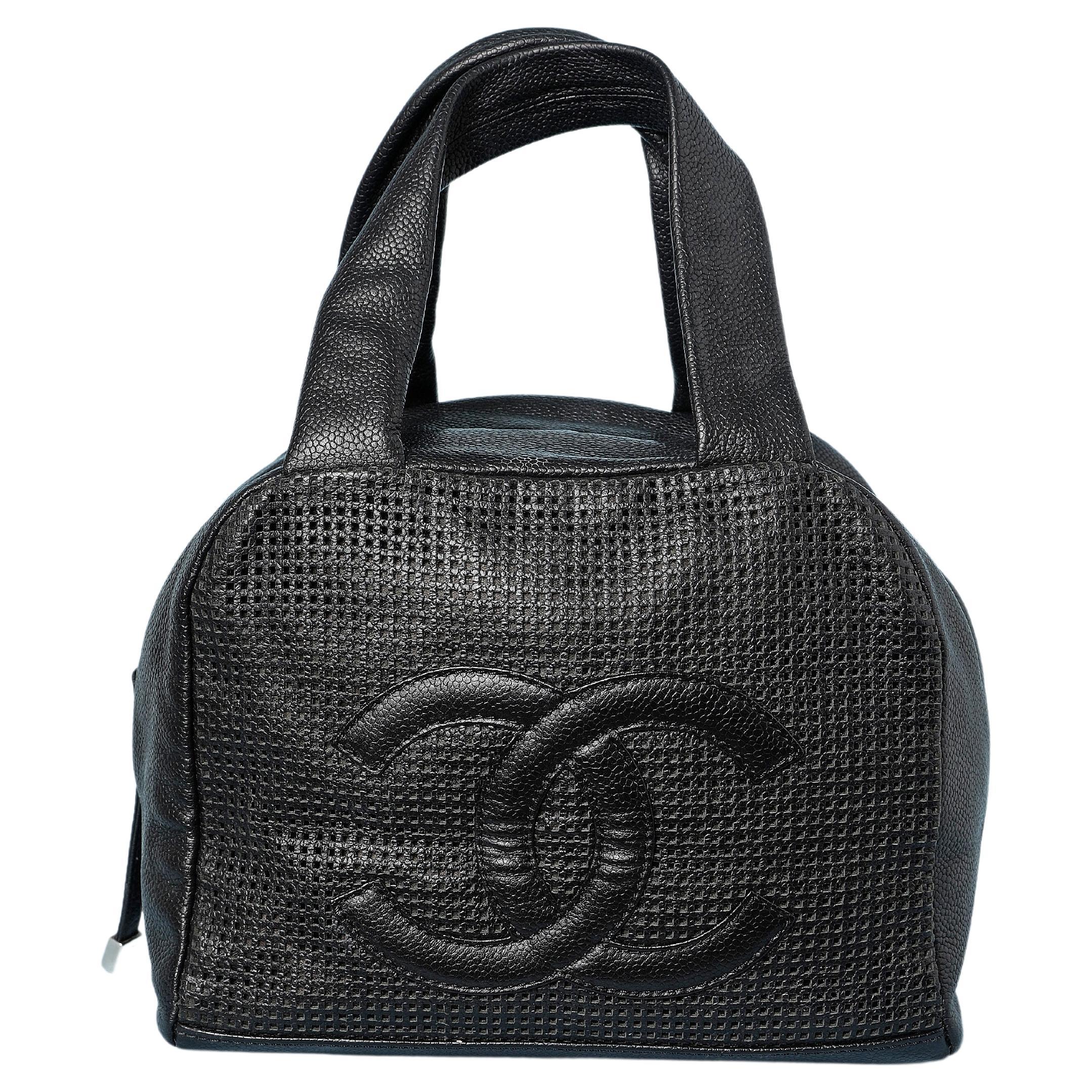 Black leather bag perforated with double C and zip Numbered  For Sale