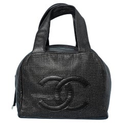 Black leather bag perforated with double C and zip Numbered 