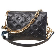 Borsa in pelle nera con monogramma in rilievo e doppia tracolla LOUIS VUITTON