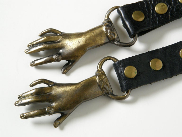 Black Leather Belt with Clasped Hands Buckle and Adjustable Length at