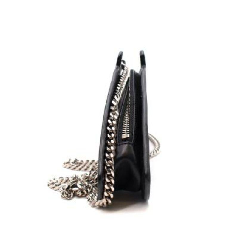 Saint Laurent Black Leather Gun Bag
 

 - Crossbody leather bag shaped like a gun 
 - Zip-top closure 
 - Chain-link chain strap 
 

 Materials
 Leather
 

 Made In Italy 
 

 9
 Very good condition with a few minor scuffs to the exterior leather
