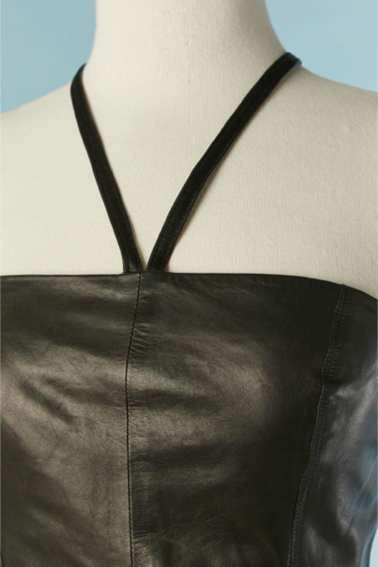 Black leather bustier dress with leather string along the neckline. Lining composition: 65% acetate, 35% rayon. 
Split in the middle back = 23cm
SIZE 40 (It) 36 (Fr) 6 (US) S 