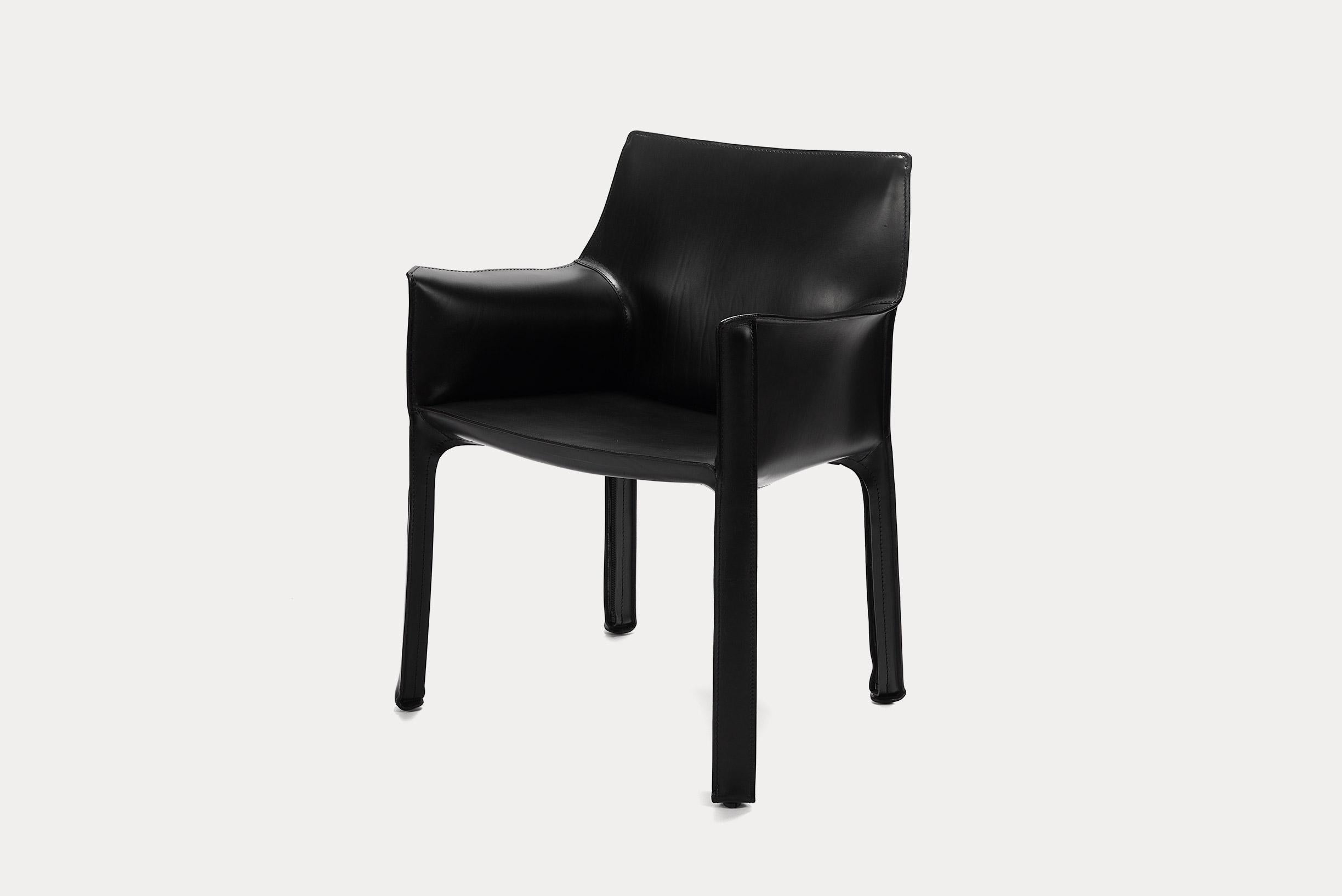Cab was conceived by the architect Mario Bellini in 1977, as an extension and prosthesis for the body: A skeleton in tubular steel and stretched, stitched leather, fastened to the frame with four zips. This chair is in black saddle leather. Cab is