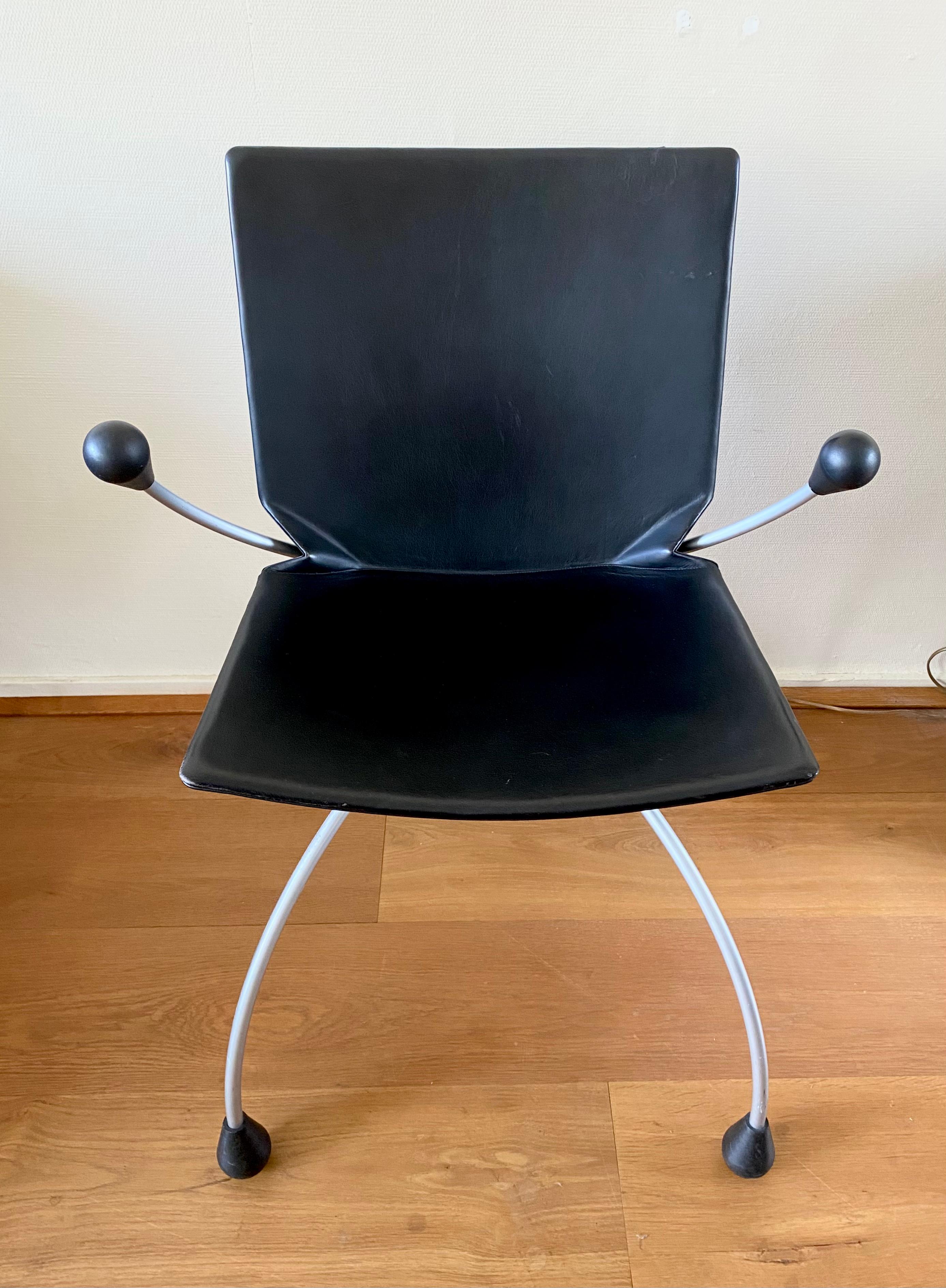 Black Leather Chair on a metal base, Designed by Pierre Mazairac & Karel Boonzaaijer for Young International. 80s Post modern Design which remains in good condition with wear consistent with age and use (see:images).