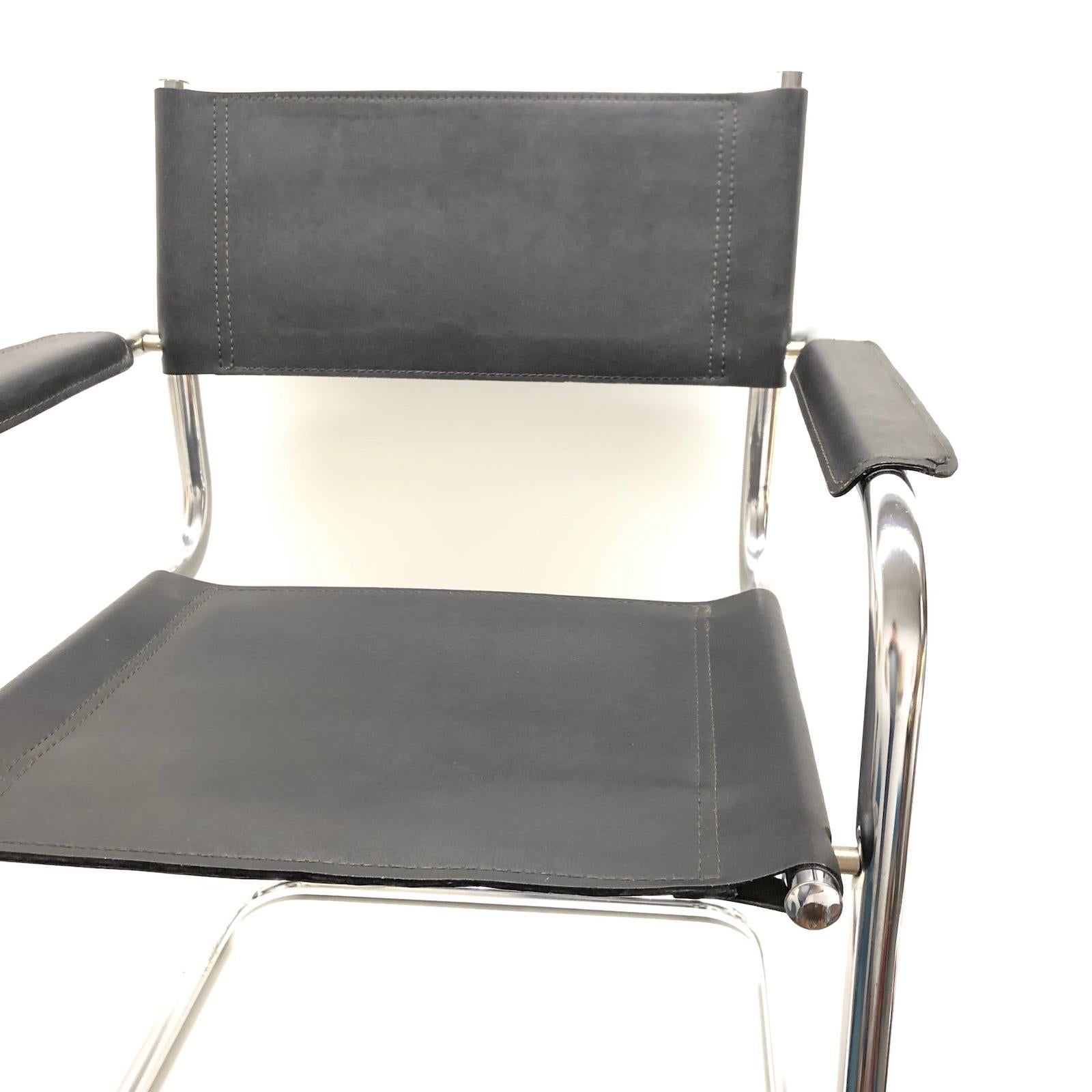 Modern vintage black leather chair cantilever tubular chrome steel frame for a desk, dining, office, living room or waiting area. The armchair is a beautiful midcentury furniture of the Bauhaus era designed in Germany.