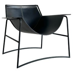Black leather club chair by Tom Ford for Gucci