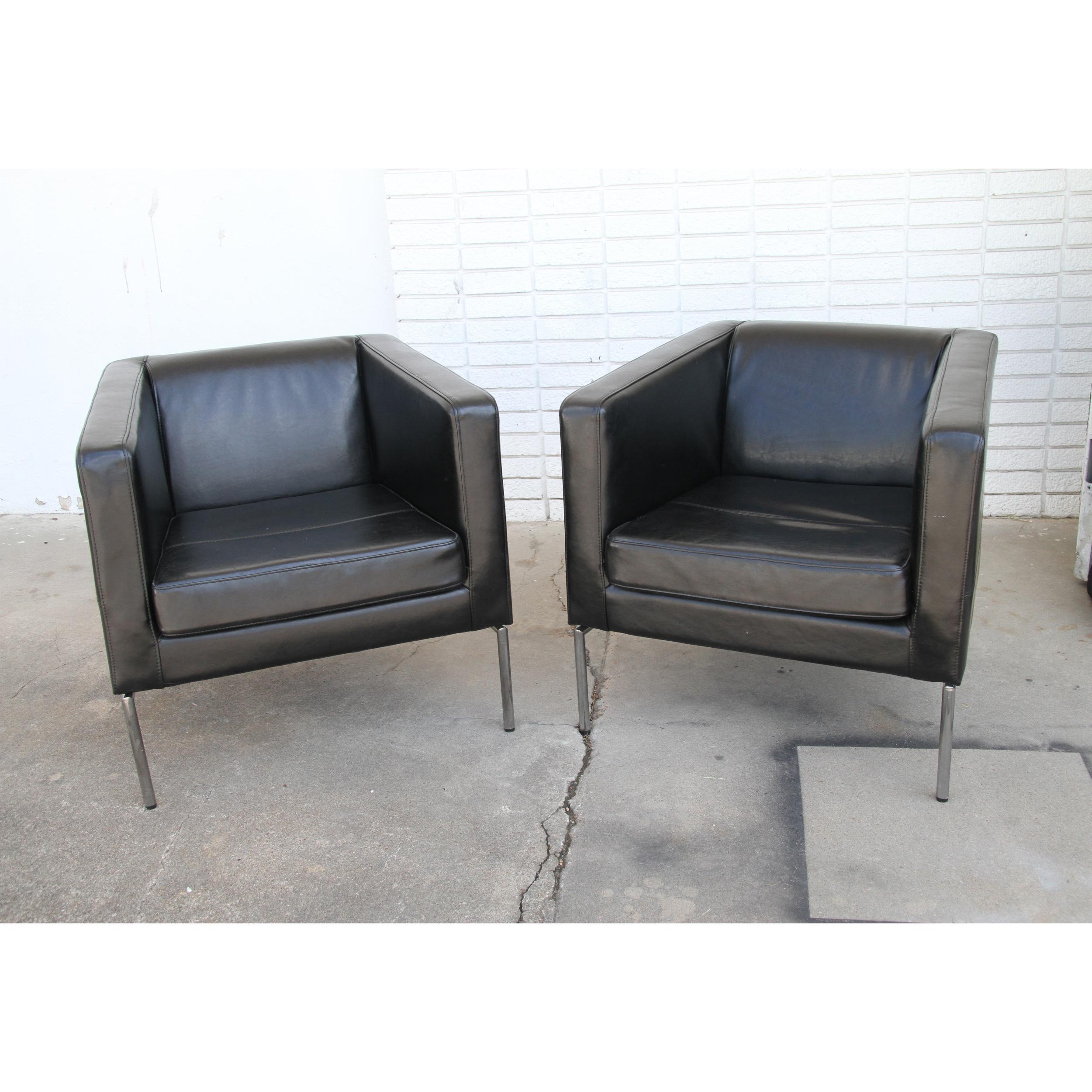 Black Leather Club Chairs upholstered in black leather with chrome legs and base.
A beautiful addition to any room.
