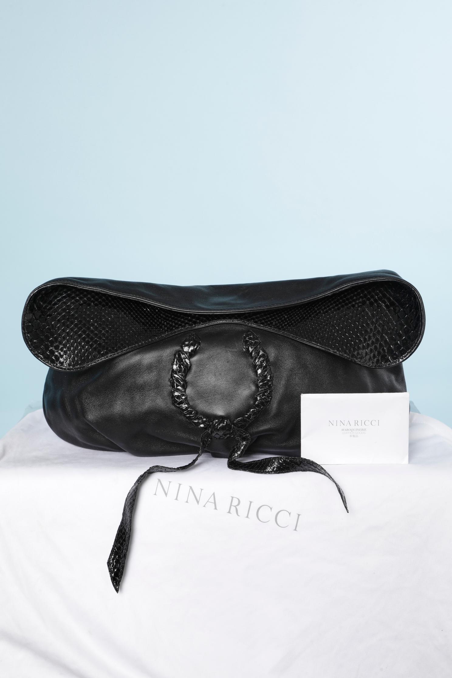 Black leather clutch with magnet closure on the top middle front. Jacquard lining. One flat pocket inside 
SIZE 40cm X 21cm 