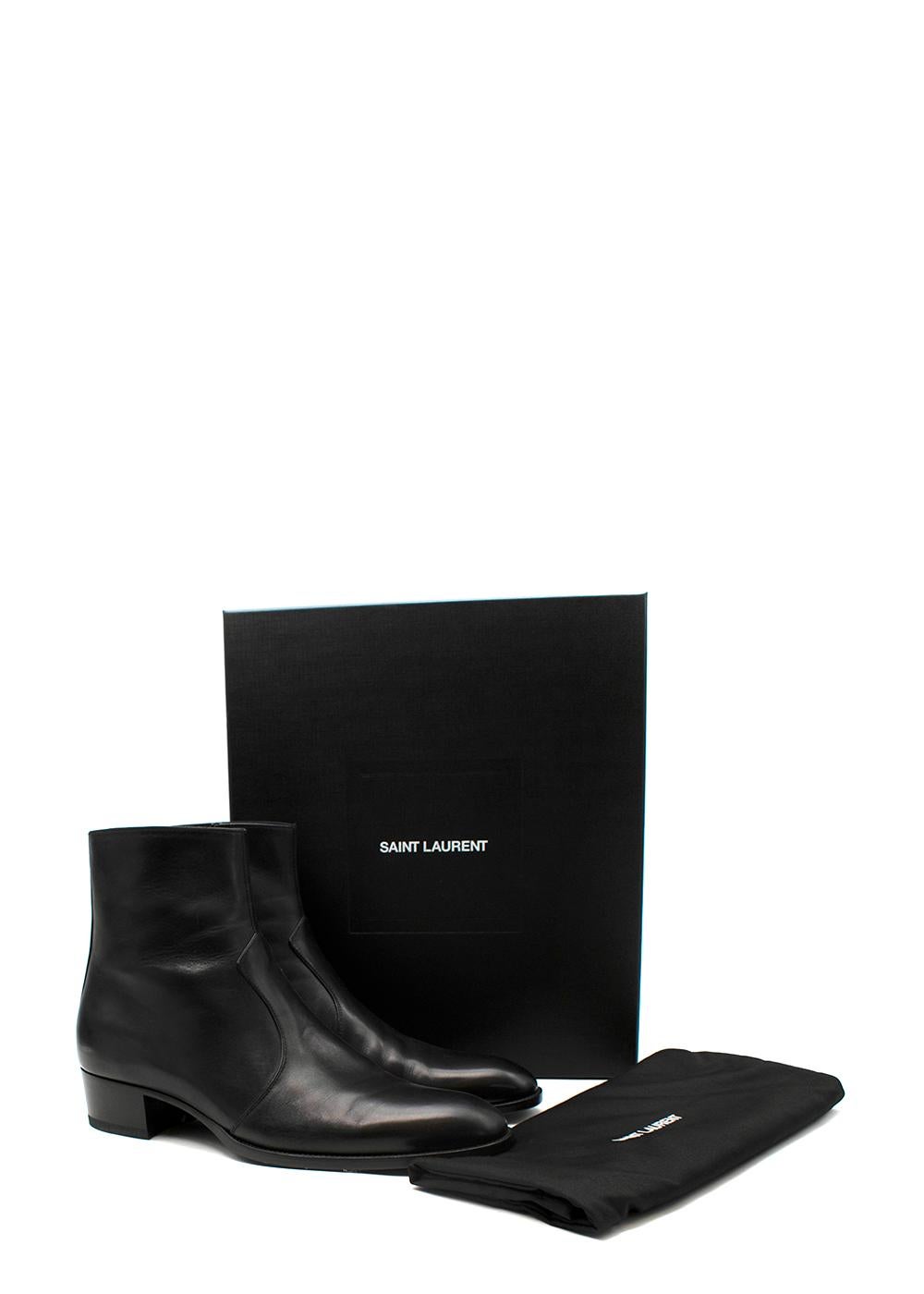 Saint Laurent Black Leather Cole Boots

- Classic black leather ankle boots with a low stacked heel
- Almond toe
- Panelled upper
- Side zip

Materials 
Leather 

Made in Italy

9.5 Excellent Condition

Length: 30 cm 
Width: 11 cm 
Heel: 4. 2
