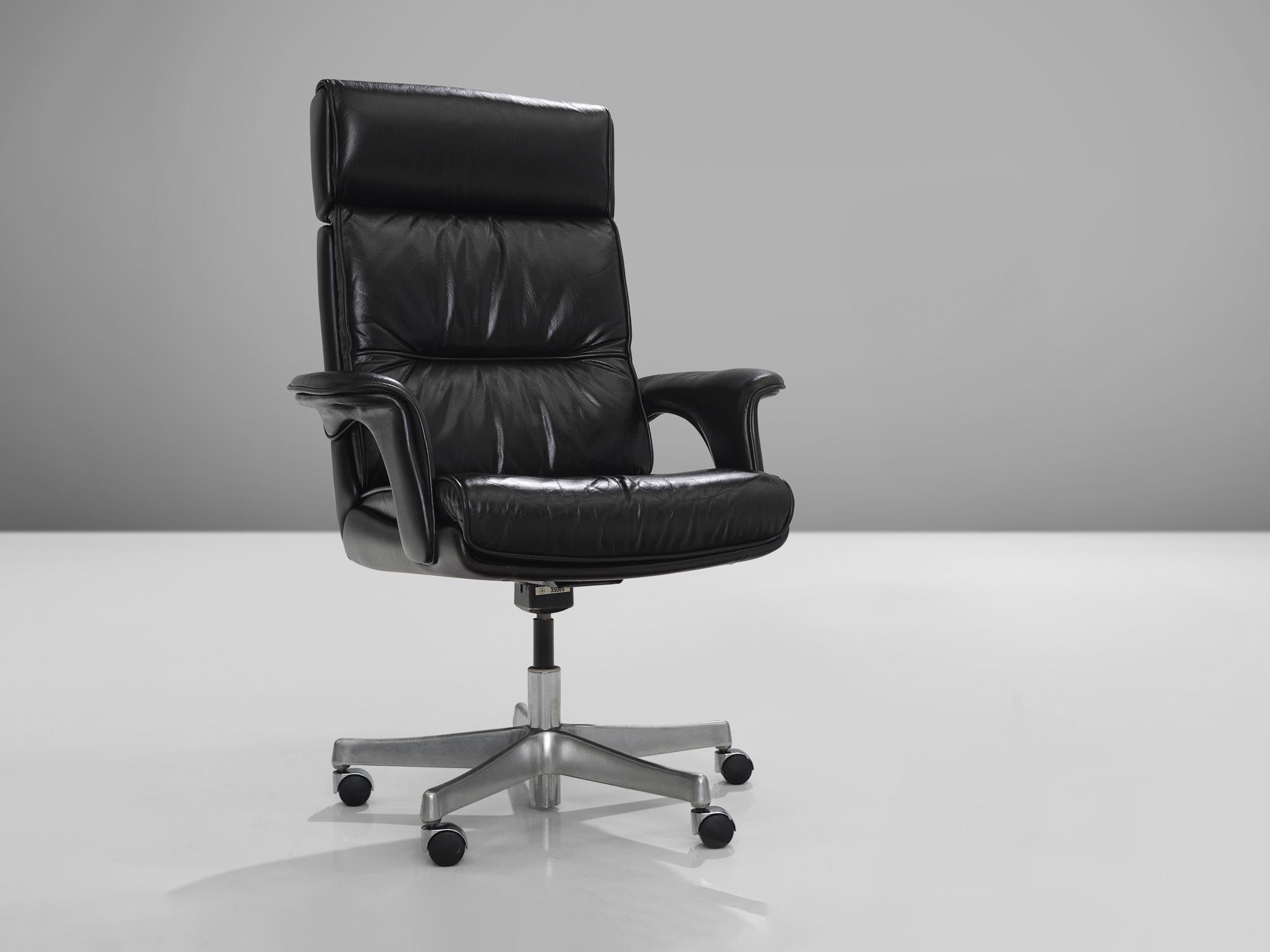 Conference chairs, leather, metal, Europe, 1980s.

These comfortable and fully adjustable swiveling executive armchairs are upholstered with a black leather. The leather has aged over time and is therefore very soft and shows great patina. The seat