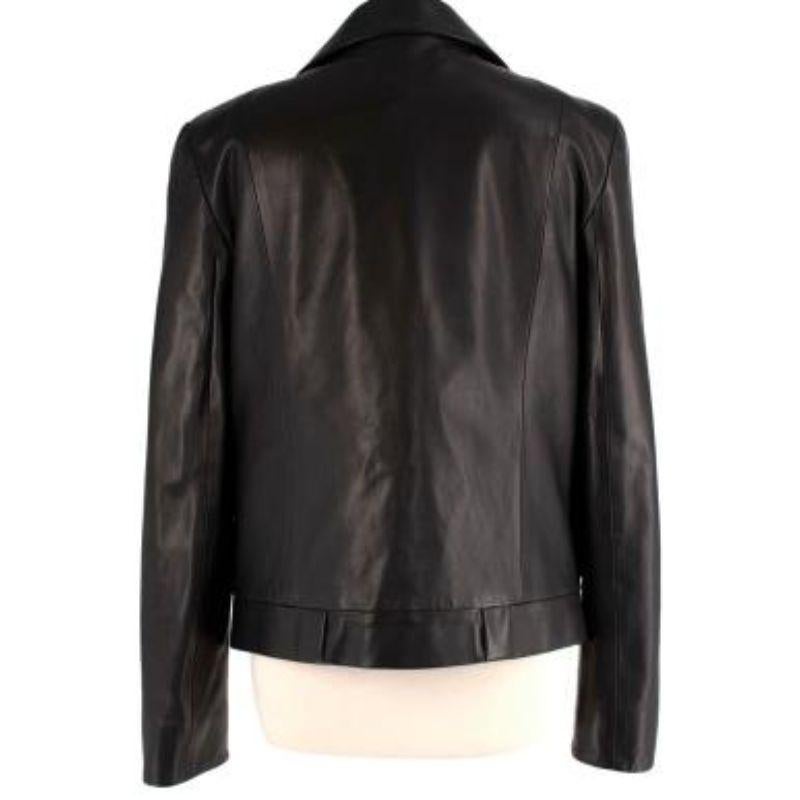 Tom Ford Black Leather Cropped Blazer
 
 - Cropped leather blazer with notched lapel, and off-centre, biker-style fastening
 - Padded shoulder
 - Bracelet length sleeve
 - Fully lined 
 
 Materials:
 Shell:
 100% Lambskin Leather 
 Lining:
 50%