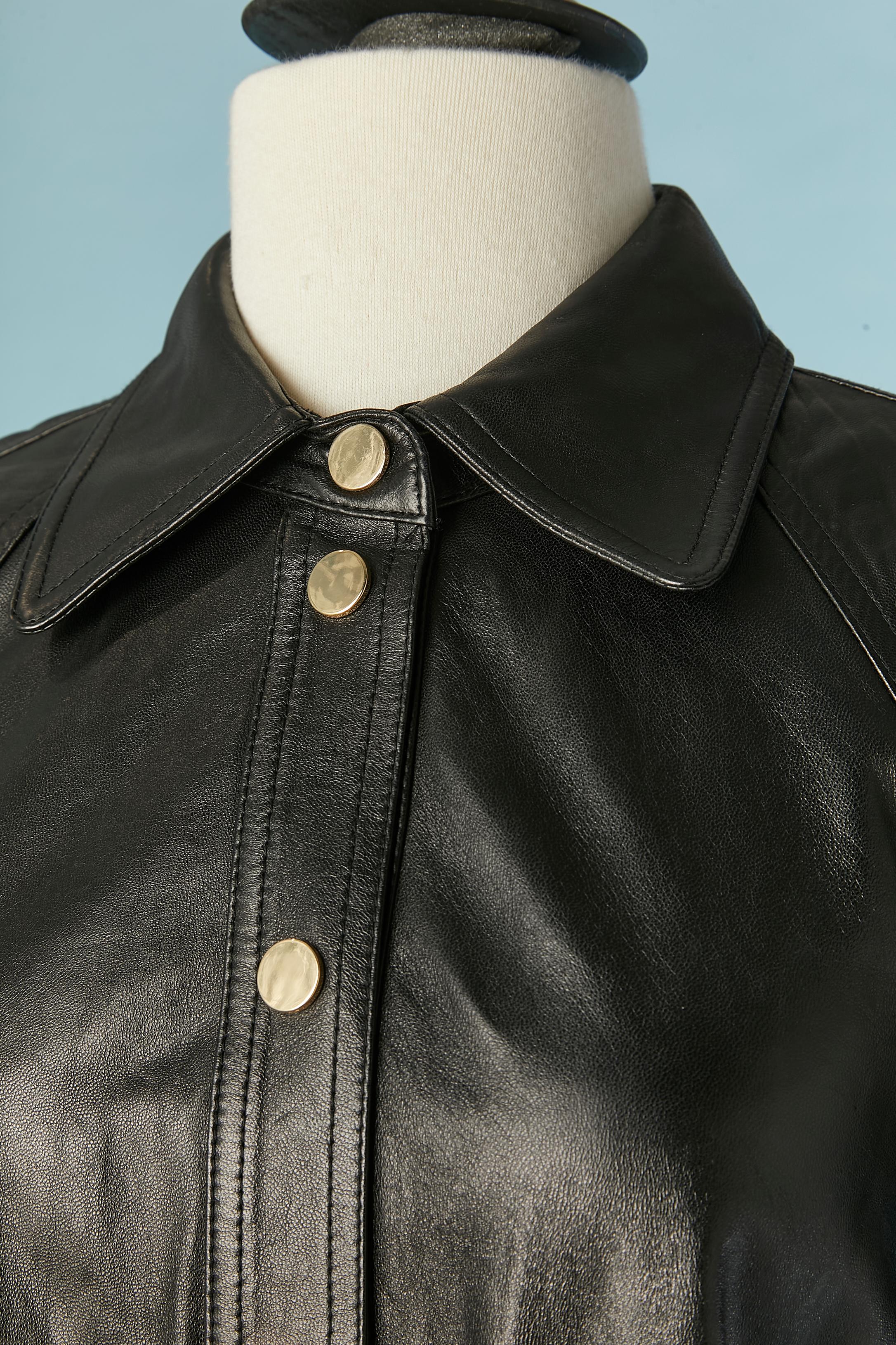 Black leather dress with gold metal snap and zipped pocket. No lining. The brand tag has been cut. 
SIZE: M 