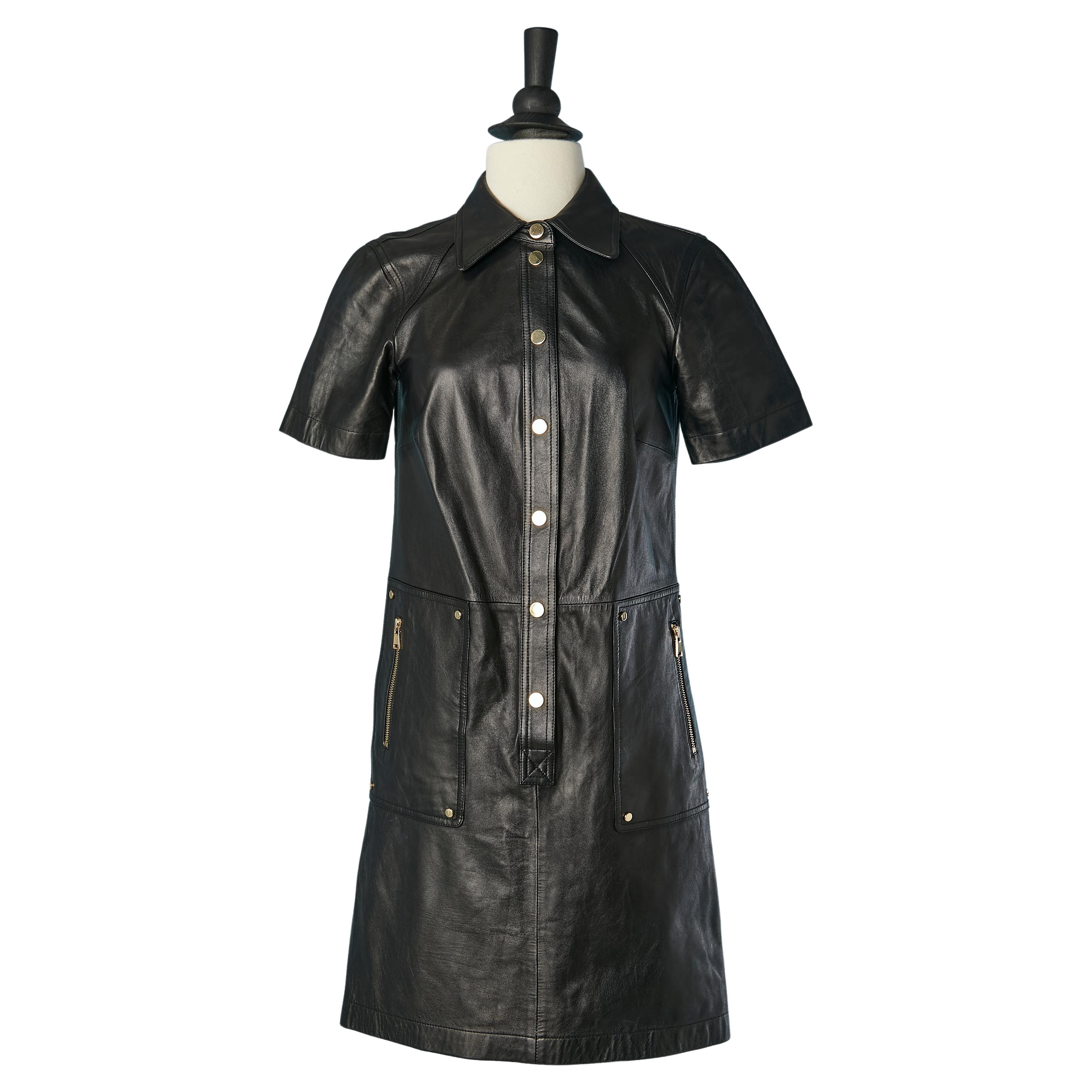 Black leather dress with gold metal snap and zipped pocket For Sale