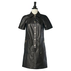Black leather dress with gold metal snap and zipped pocket