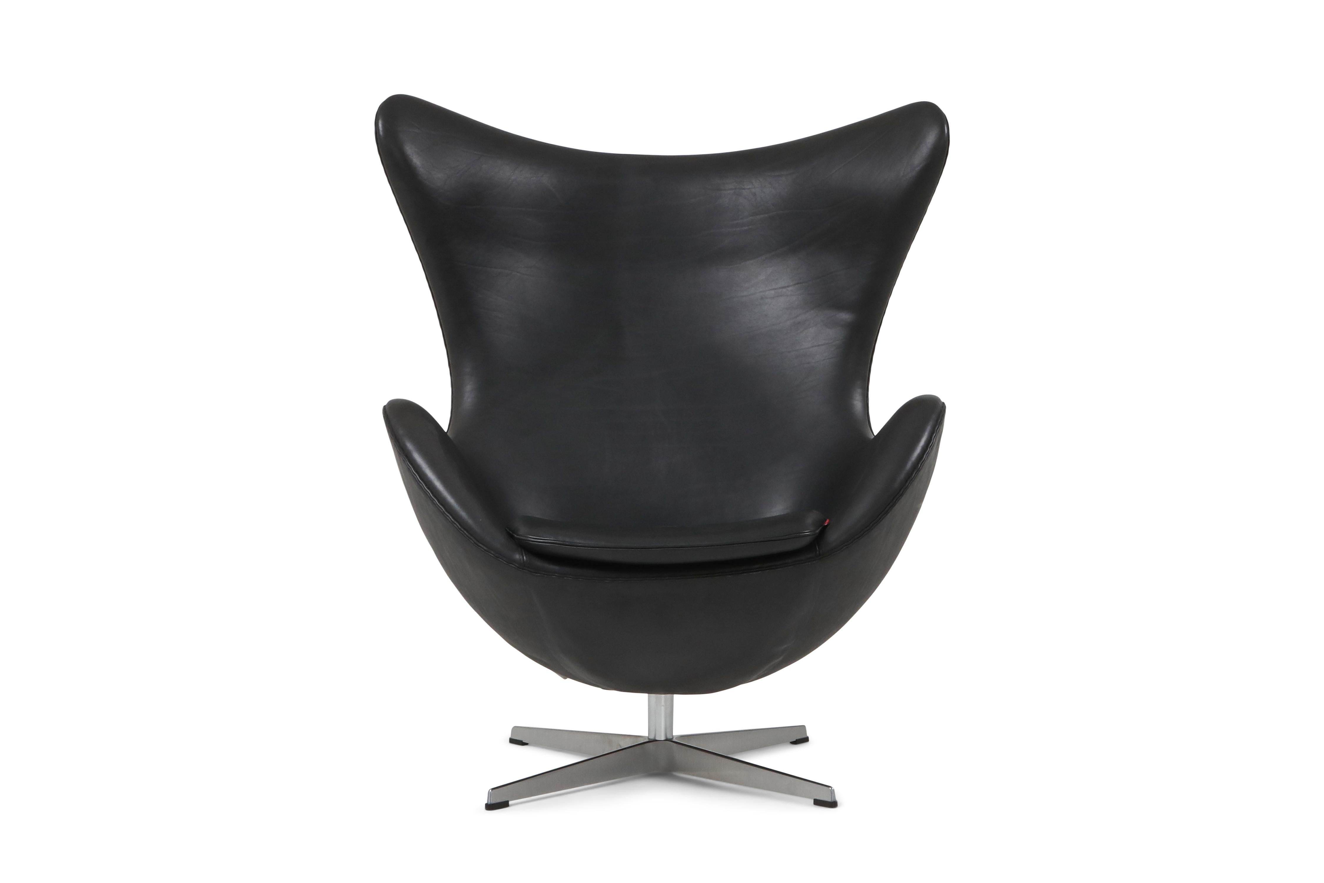 Arne Jacobsen egg chair in black aniline leather, Fritz Hansen, Denmark

The egg is one of the triumphs of Jacobsen’s total design - a sculptural contrast to the building’s almost exclusively vertical and horizontal surfaces. The egg sprang from a
