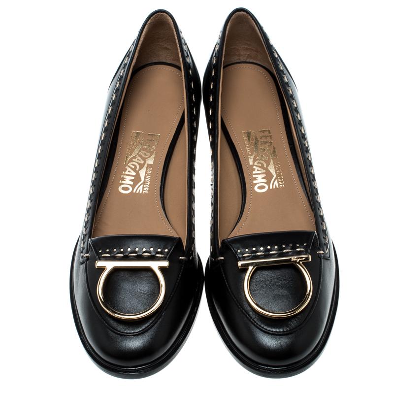 Add value to your ensemble by slipping into this pair of Salvatore Ferragamo pumps. Made from leather, they feature Gancio details on the uppers and block heels for a slight lift. Put up a beautiful smile by wearing these marvellous