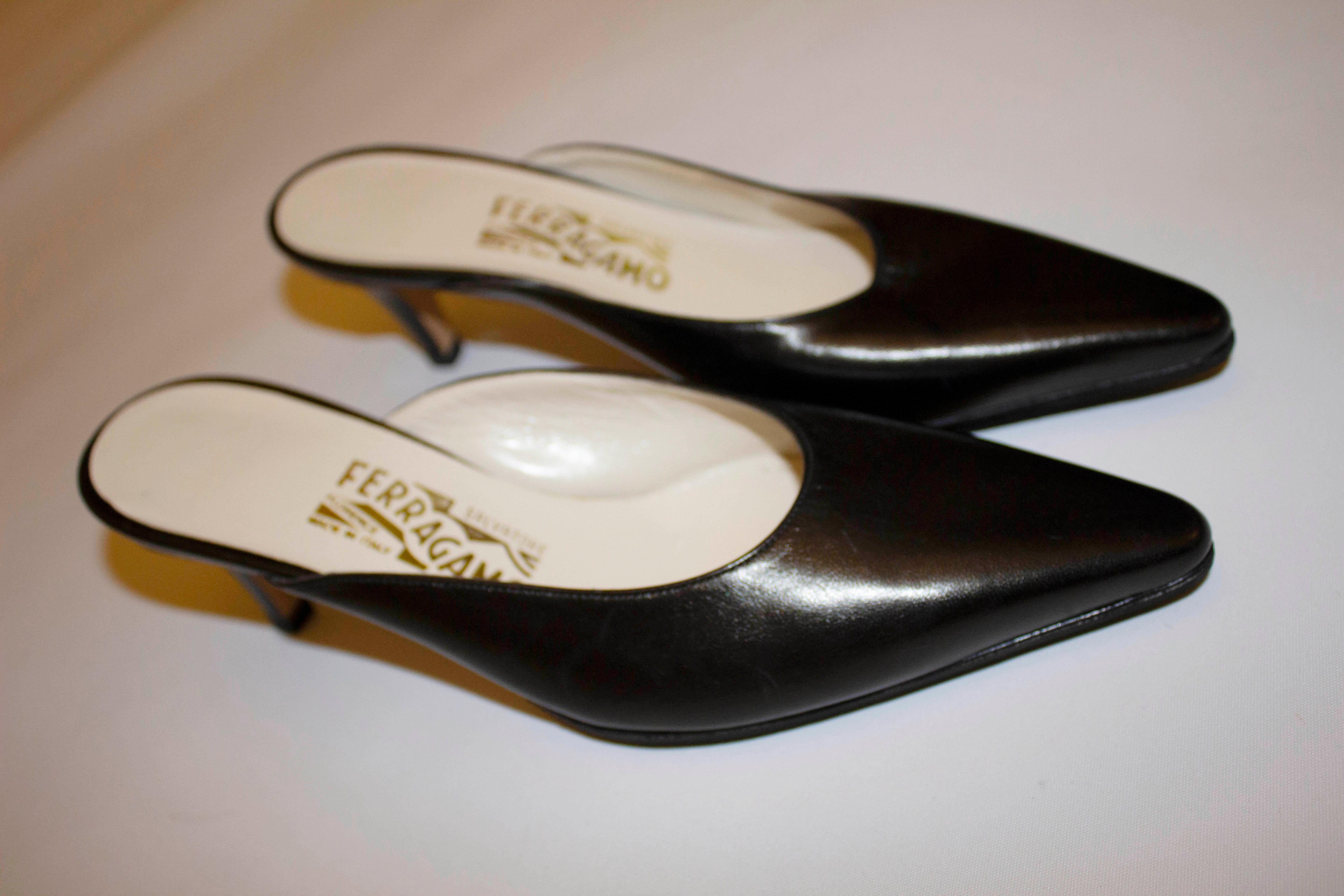 A chic pair of black leather mules by Ferragamo of Italy. As you would expect the leather is of wonderful quality, with leather tops and soles.  Heel height 3''
Model : DS 70229H50 6C