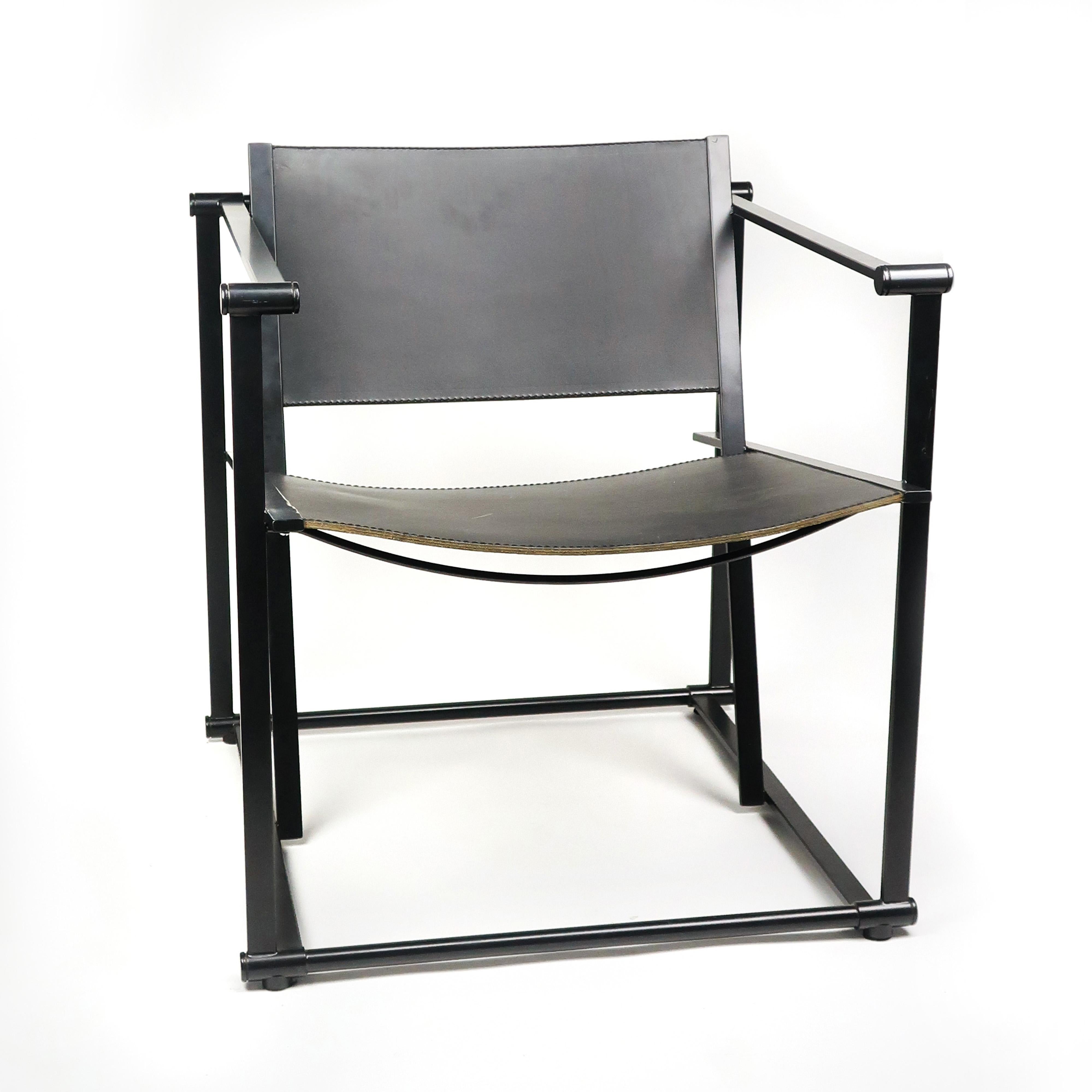 A vintage FM62 cube chair by Radboud Van Beekum for Pastoe with a black enameled frame and black saddle leather seat and back. Originally introduced in 1980 during the Triennale in Poznan, Poland. Radboud Van Beekum graduated from the Gerrit