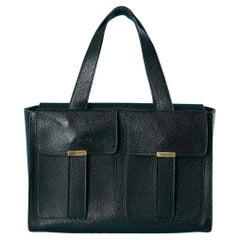Black leather hand bag with 2 front pockets Yves Saint Laurent 