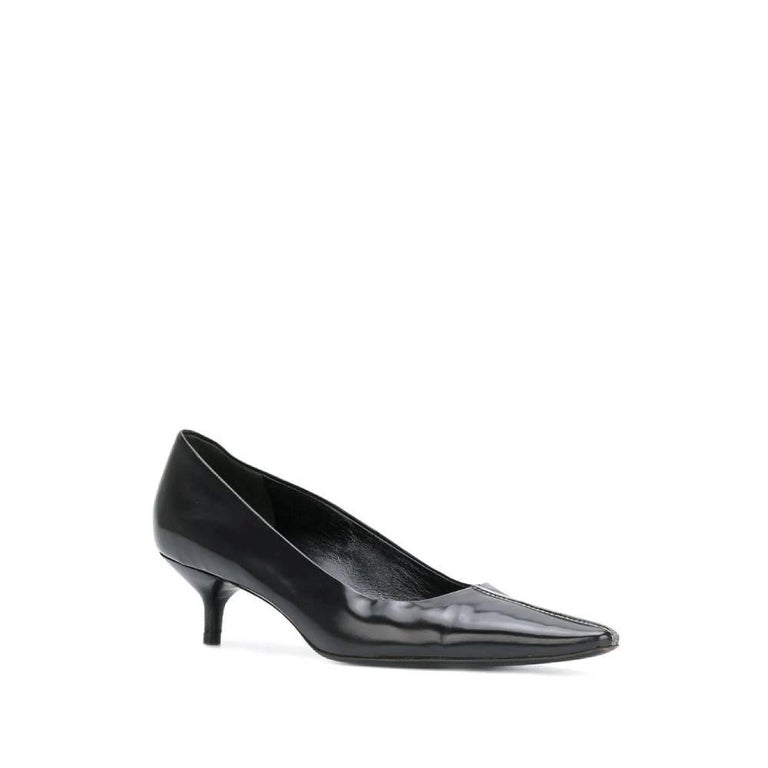 Black leather Helmut Lang 2000s pumps. Pointed toe with embossed central seam. Kitten heel.

Size: 37 IT

Measurements
Insole: 24,5 cm
Heel: 4,5 cm

Product code: A8140

Notes: Item shows light signs of wear on the leather, as shown in the