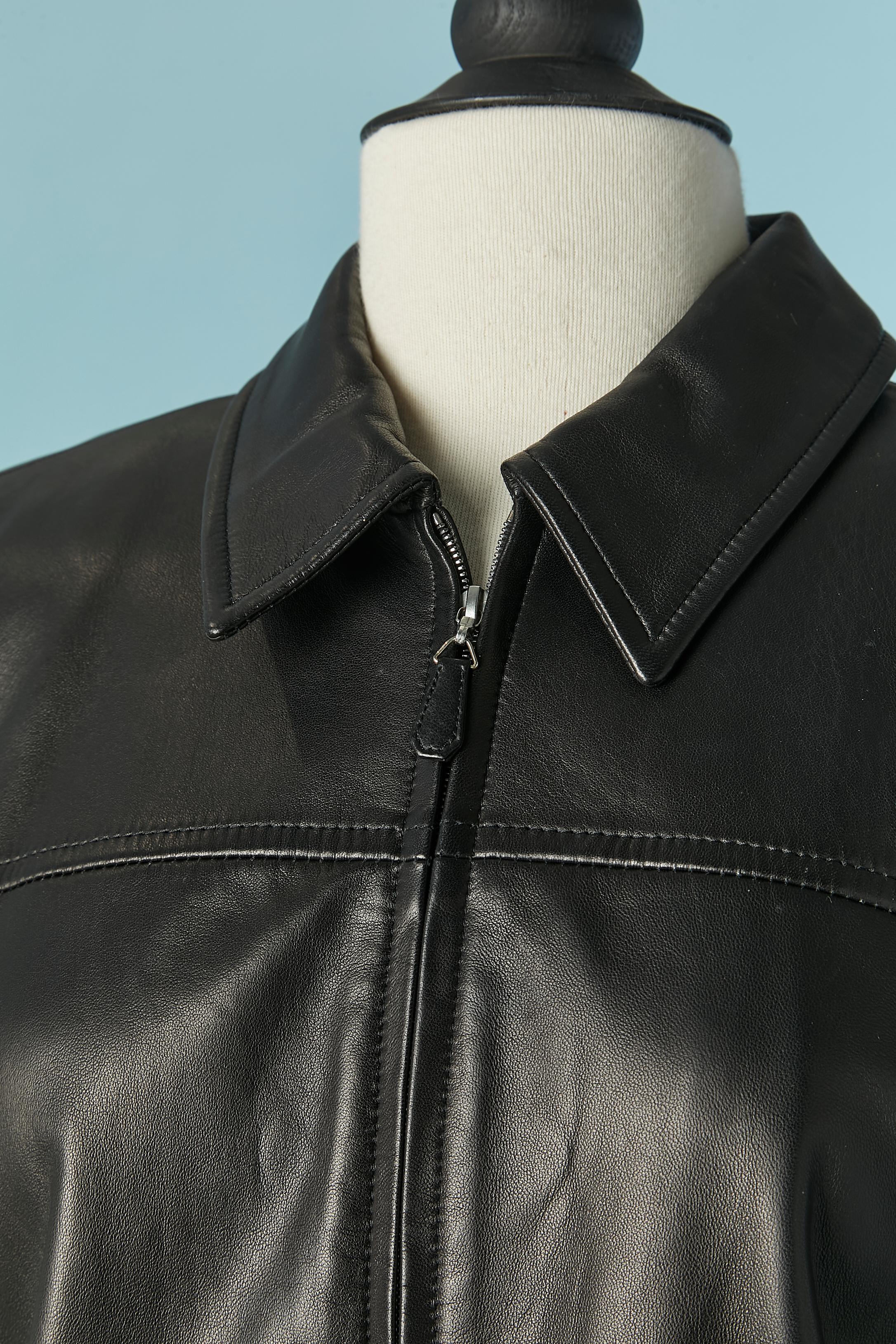 Black leather jacket and trouser ensemble. Branded rayon lining. Shoulder pad . Zip closure on the middle front and on the cuffs. 
JACKET'S SIZE : 38 / M 
TROUSER'S SIZE: 42 / L 