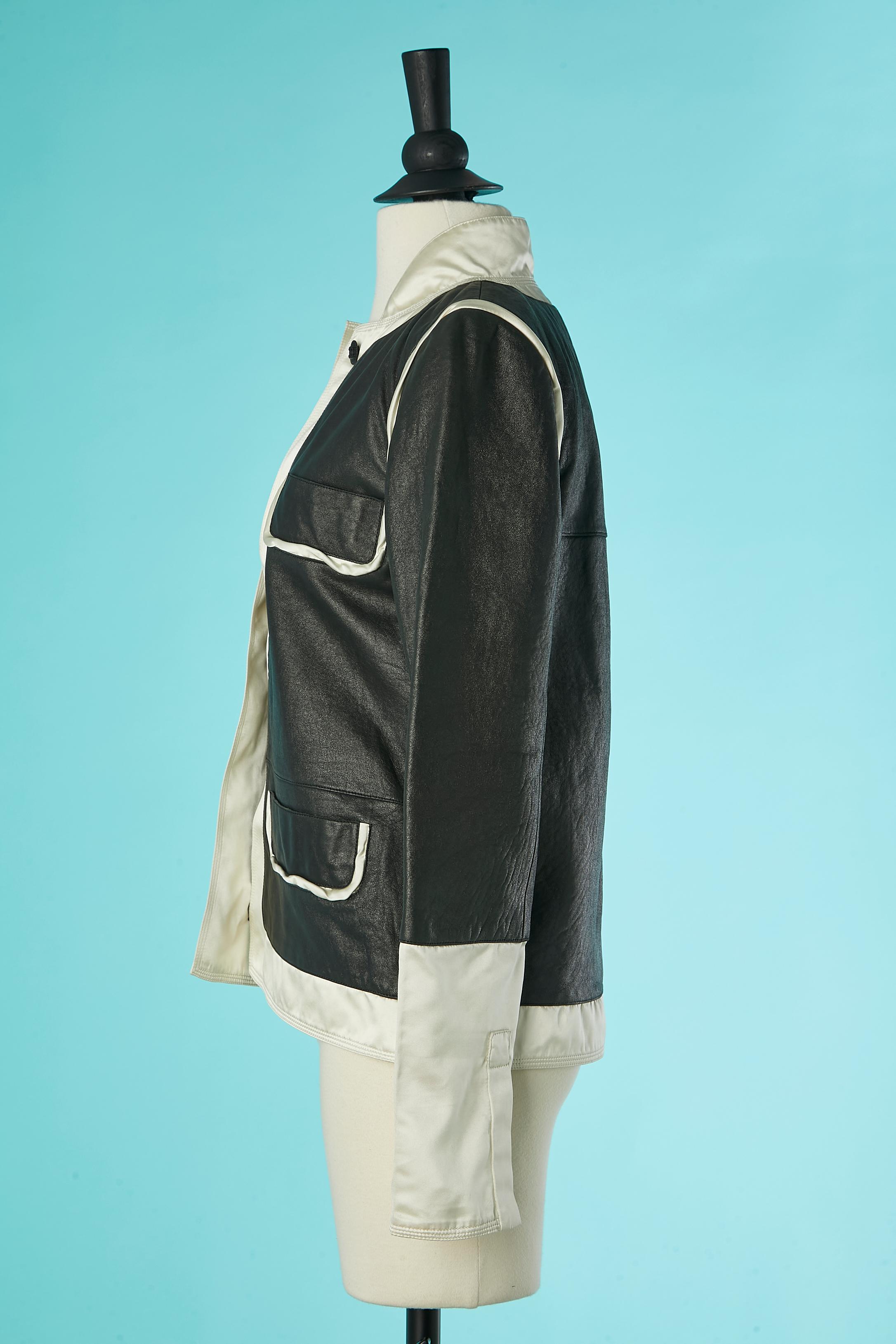 Women's Black leather jacket with ivory satin edge and branded decorative button Chanel