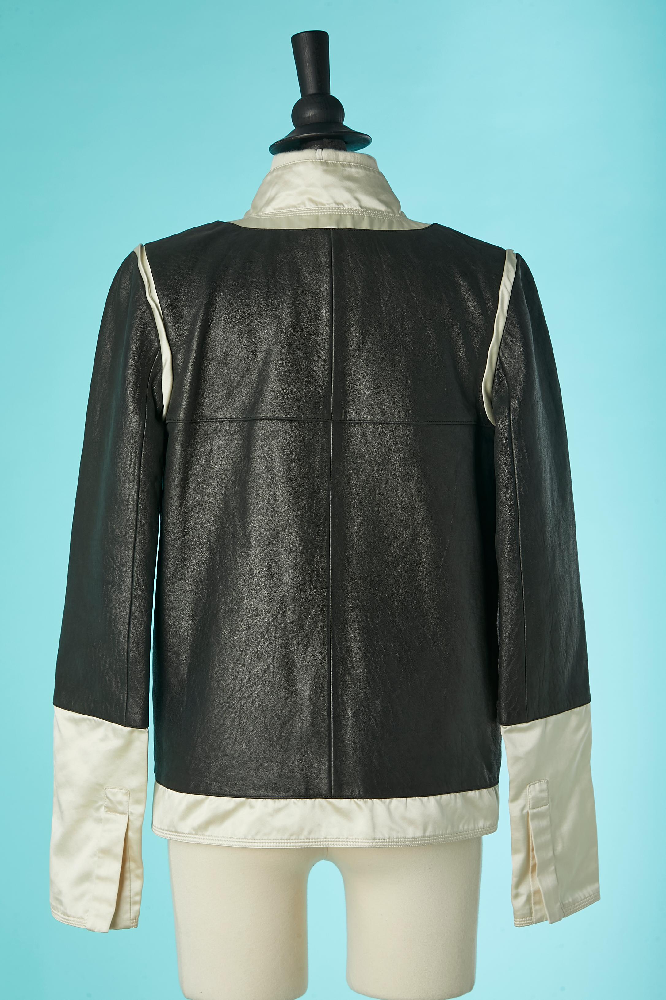 Black leather jacket with ivory satin edge and branded decorative button Chanel 1