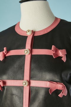 Black leather jacket with pink leather strap and bow GUCCI