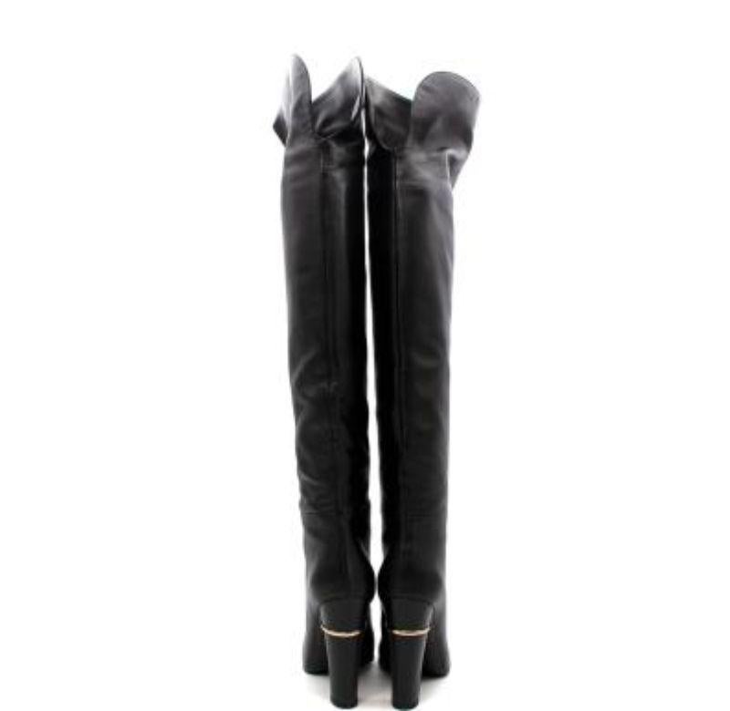 Sergio Rossi Black leather knee high boots
 

 - Leather high knee boots 
 - Gold tone detail on the back of each heel 
 - Slip on (no zippers) 
 - Rounded point toe 
 

 Materials 
 100% Leather 
 

 Made in Italy 
 9.5/10 Excellent Condition
 

