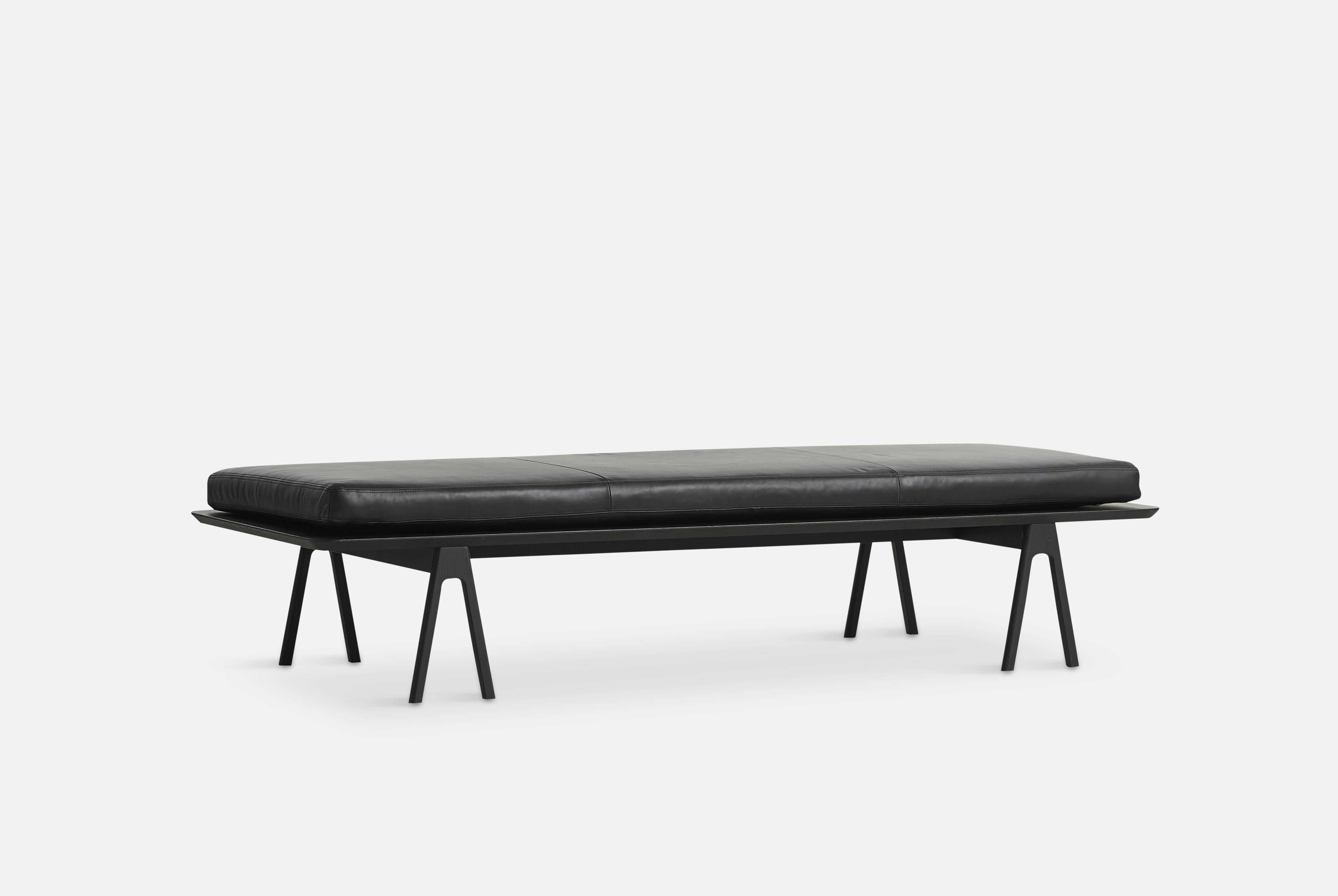 Black leather level daybed by Msds Studio
Materials: Camo leather, foam, oak.
Dimensions: D 76.5 x W 190 x H 41 cm
Also available in different materials. 

The founders, Mia and Torben Koed, decided to put their 30 years of experience into a