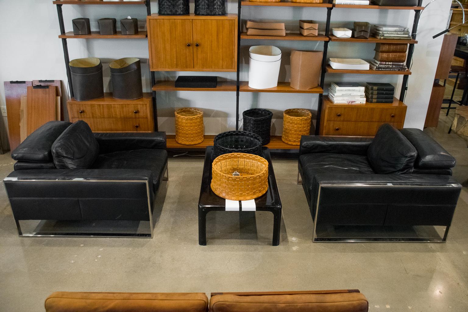 Pair of black leather and chrome framed lounge chairs in Classic Italy, 1980s style. Incredibly comfortable with extendable headrests. Styling similar to Roche Bobois or B & B Italia.

Height with headrests extended: H 36.5