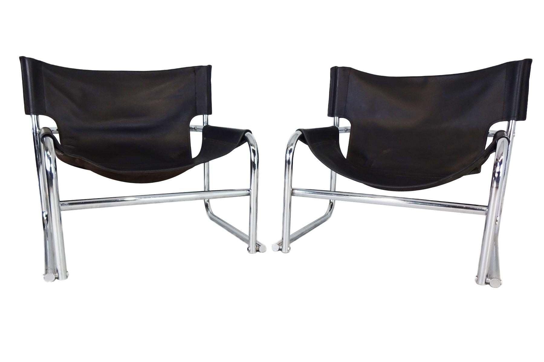 Vintage late midcentury black leather T1 sling lounge chairs by Rodney Kinsman for OMK.

Kinsman trained at the Central School of Art and in 1966 founded OMK furniture with partners Jurek Olejnik and Bryan Morrison in 1966, the company name being