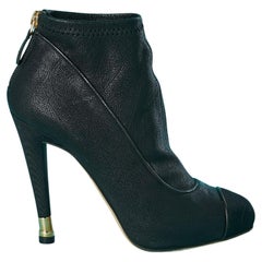 Used Black leather low boots with inside platform and metalic details on heel Chanel 