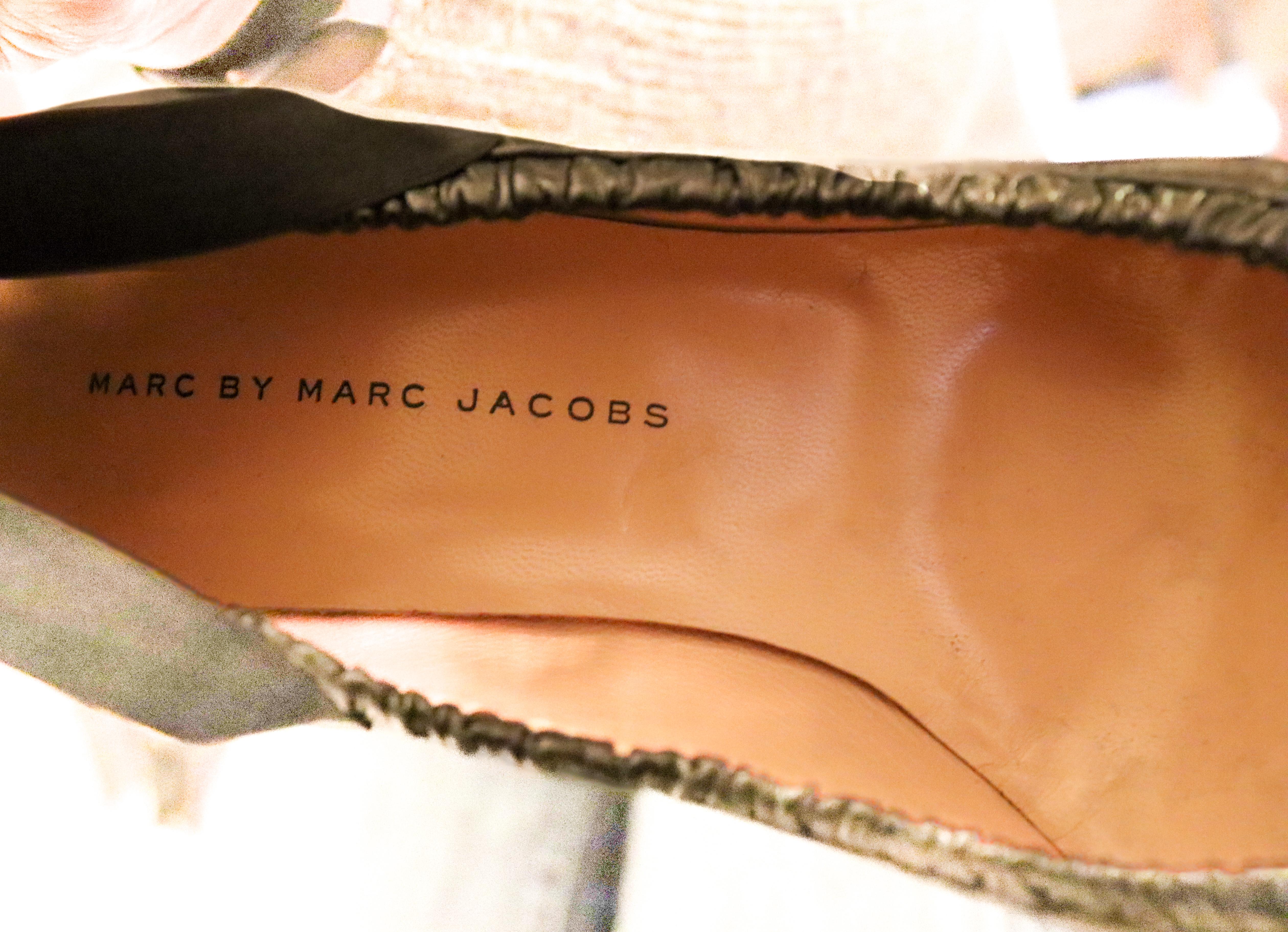 A great pair of shoes by Marc Jacobs, Marc by Marc Jacobs line. In super soft black leather the shoes are peep toes with bow detail and a frill along the edge. 
Leather sole and lining. Made in Italy Size 39 1/2 , heel height 3 1/2''