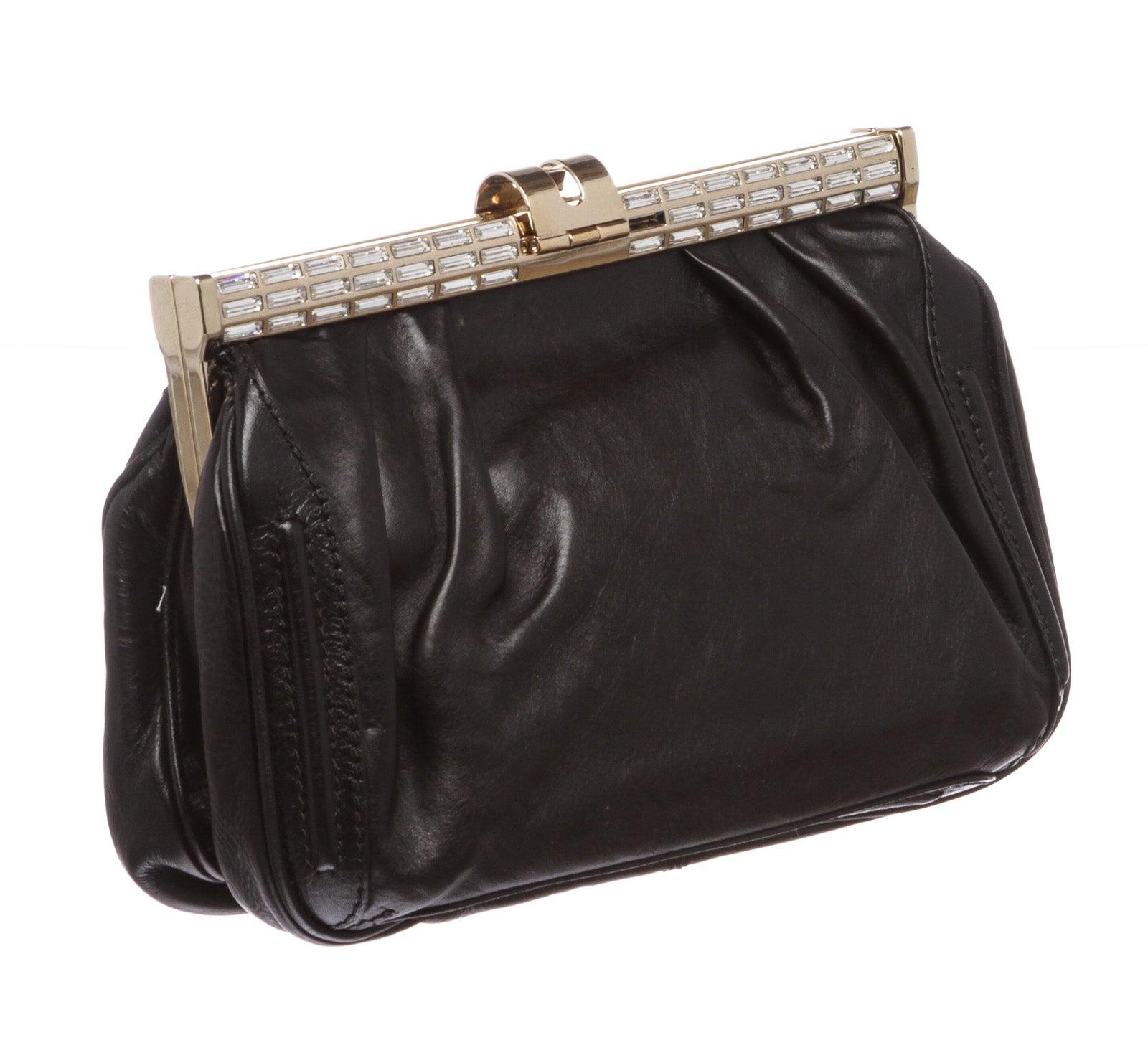Black leather MCM clutch with gold-tone hardware and small crystal In Fair Condition In Irvine, CA
