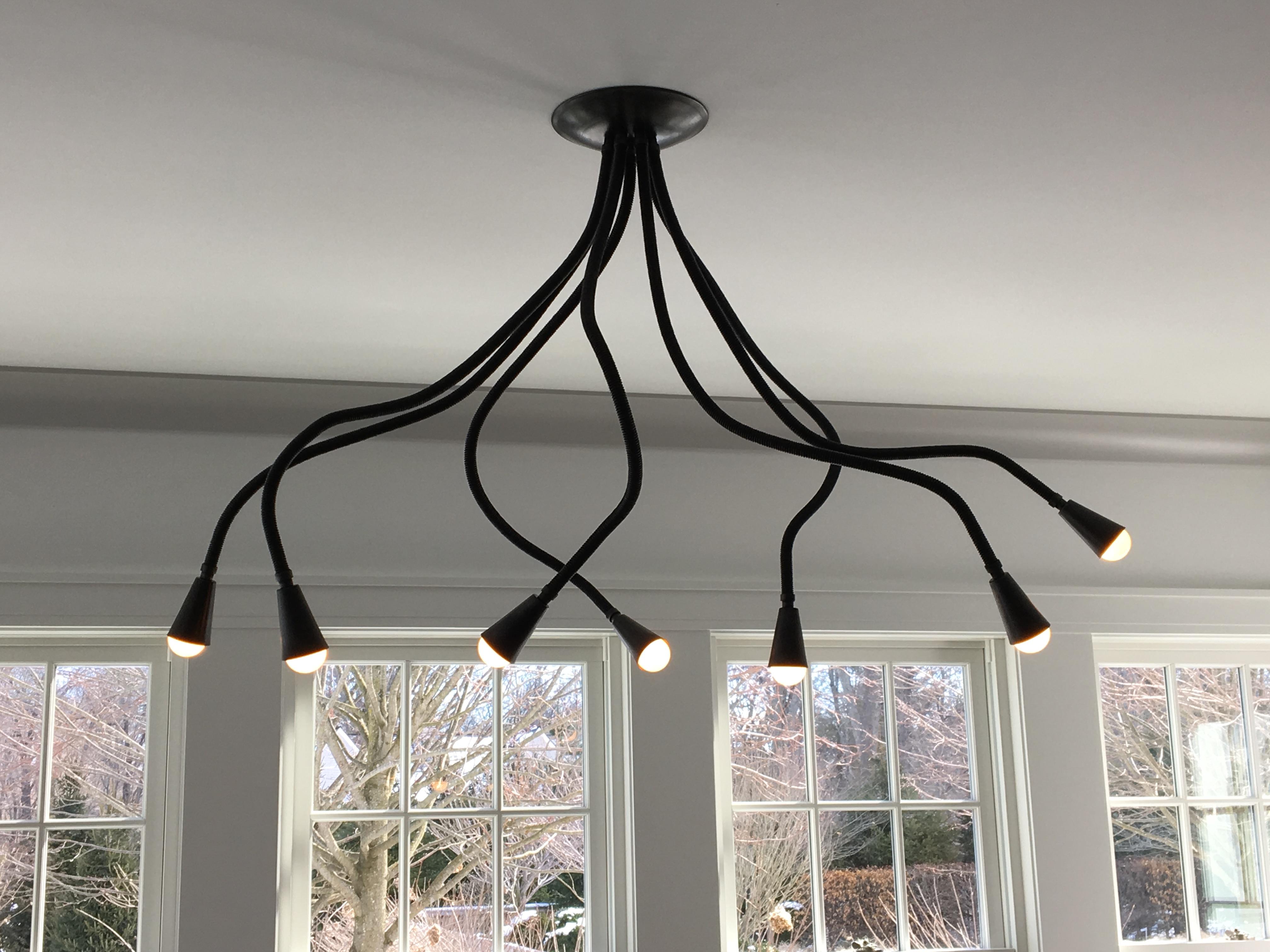 7-arm all black meander chandelier with matte black leather and black metal finish. Adjustable arms let you style the chandelier as you wish. Overall measurements vary depending on how you pose the arms.
Arms are 36
