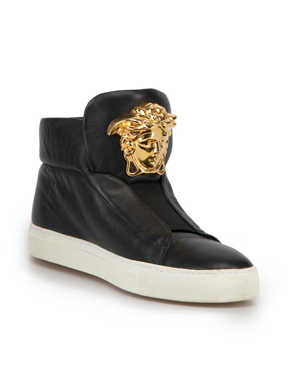 CONDITION is Very good. Hardly any visible wear to trainers is evident on this used Versace designer resale item. 
 
 Details
  Black
 Leather
 High top trainers
 Round toe
 Flatform white rubber heel
 Elasticated strap
 Gold tone medusa head