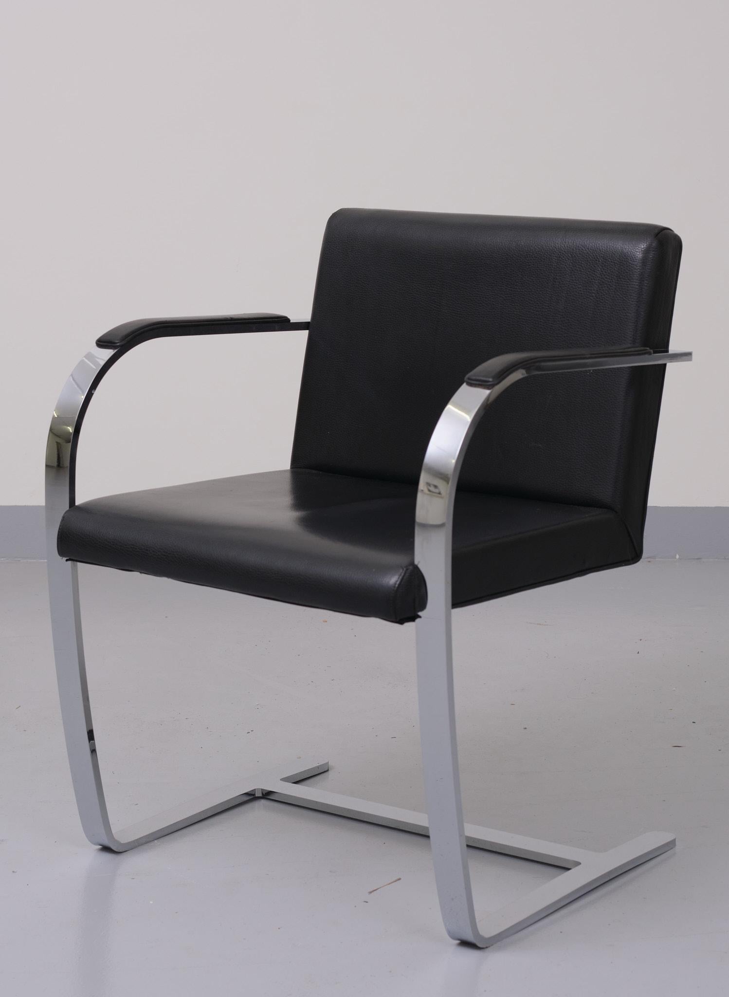Classic design. Flat bar frame, comes with black leather upholstery. 1980s good condition 
Design Ludwig Mies van Rohe.
 