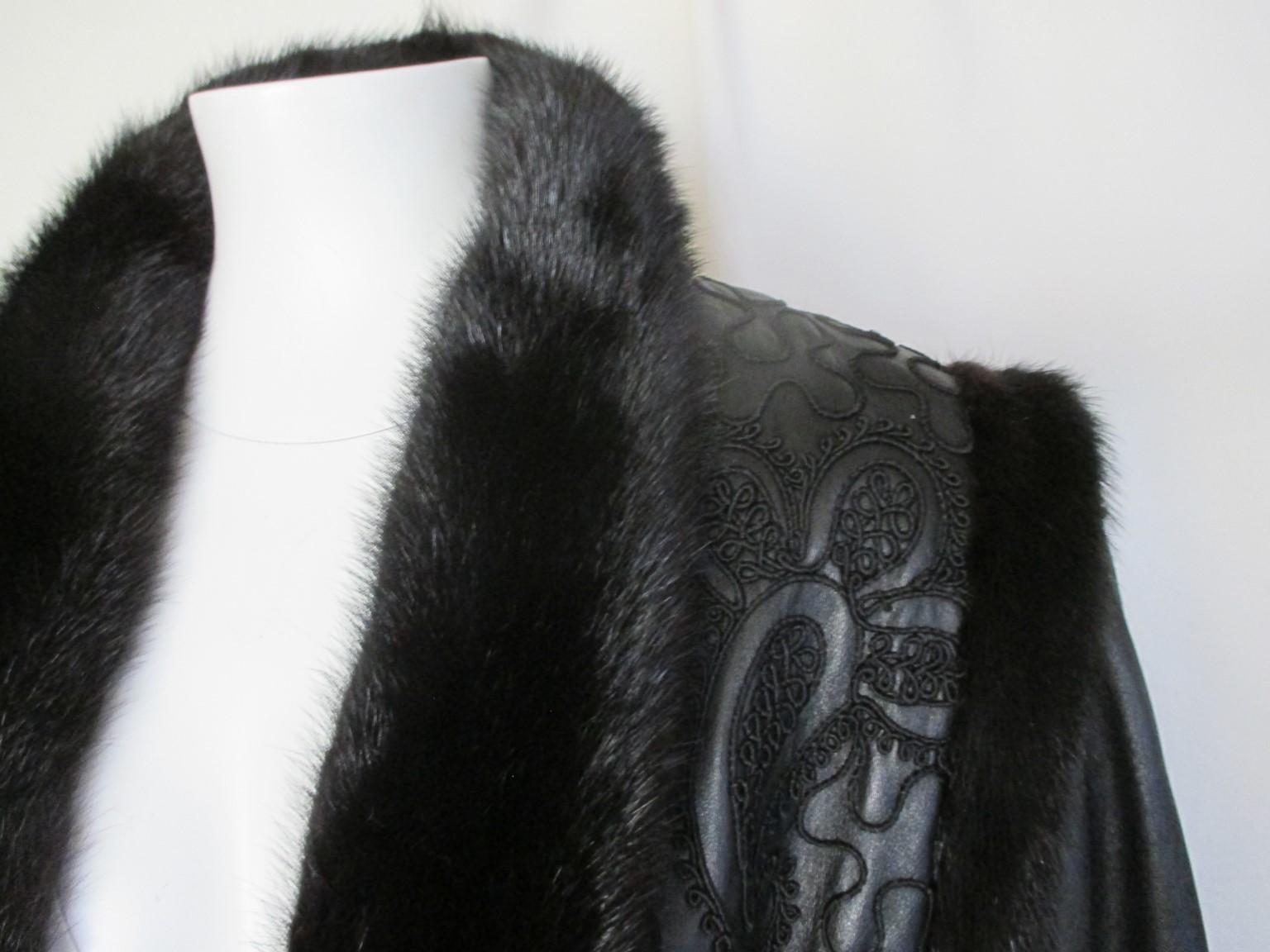 This rare vintage jacket is made from leather designed with persian Lamb fur
and trimmed with mink fur.

We offer more luxury fur items, view our frontstore.

Details:
Color: black
Fully lined
In pre-owned condition with some minor wear at the