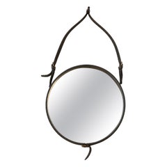 Black Leather Mirror Covered by Hermès Designed by Jacques Adnet, France 1950.