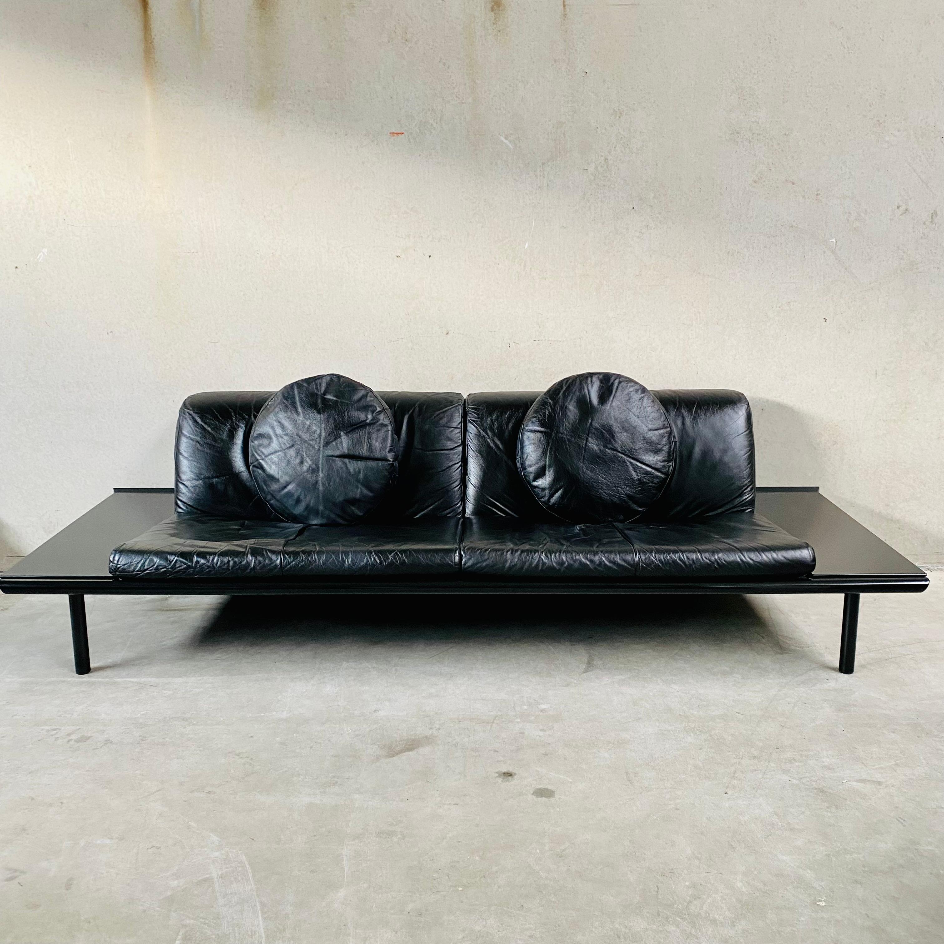 If you're looking for a sleek and stylish addition to your living room, look no further than the Mission model three-seater leather sofa from Harvink 1980. Crafted with a black lacquered wooden frame, this sofa is the epitome of modern