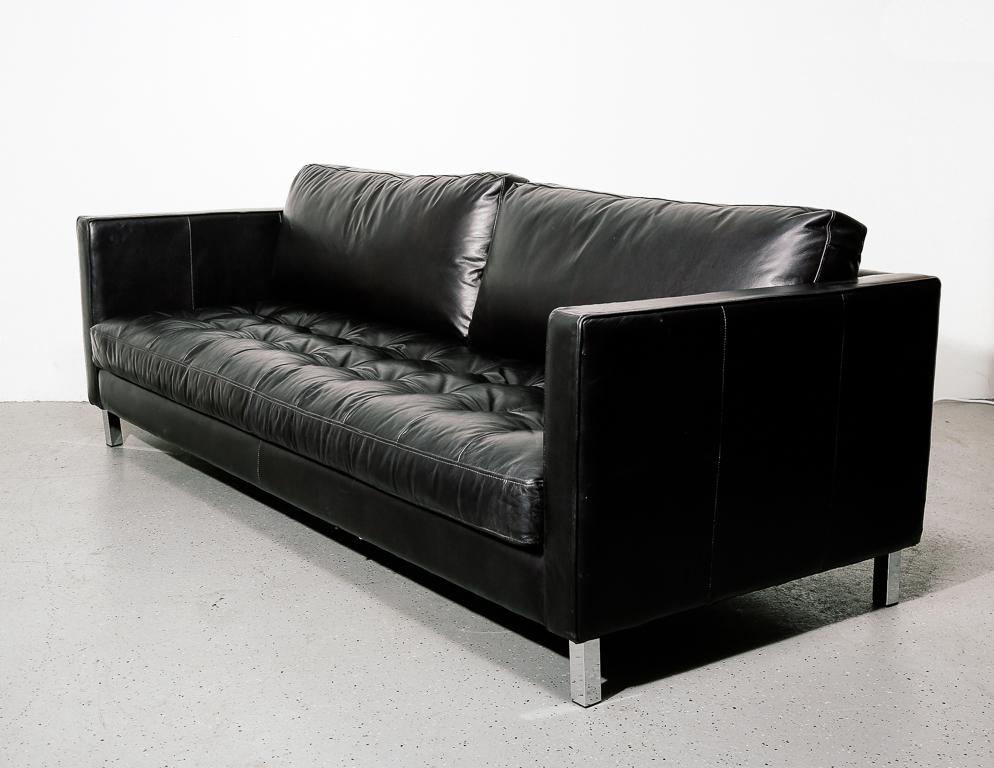 Vintage sofa in black leather. Tufted bottom cushion and chrome legs. Unsigned.

Measure: 15