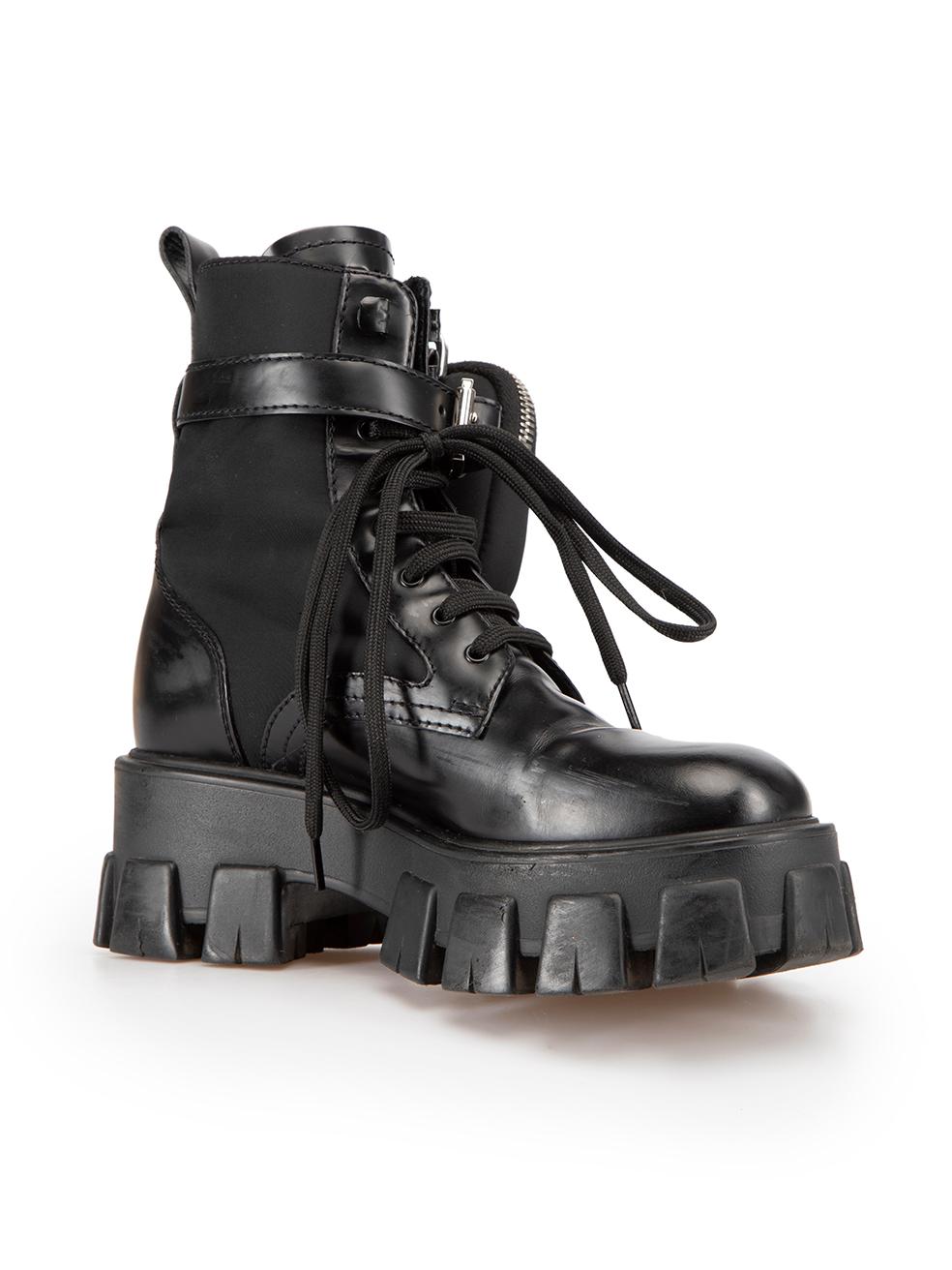 CONDITION is Very good. Minimal wear to boots is evident. Minimal wear to outer-soles and right side of left boot with minor scuff marks and general creasing to the leather of both boots on this used Prada designer resale