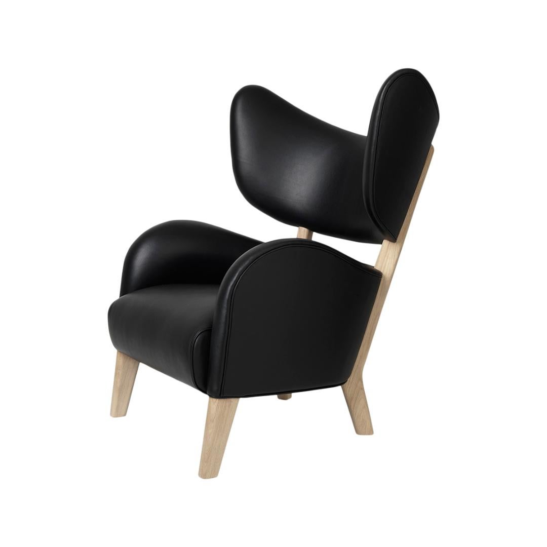 Black leather natural oak my own chair lounge chair by Lassen.
Dimensions: W 88 x D 83 x H 102 cm 
Materials: Leather.

Flemming Lassen's iconic armchair from 1938 was originally only made in a single edition. First, the then controversial,