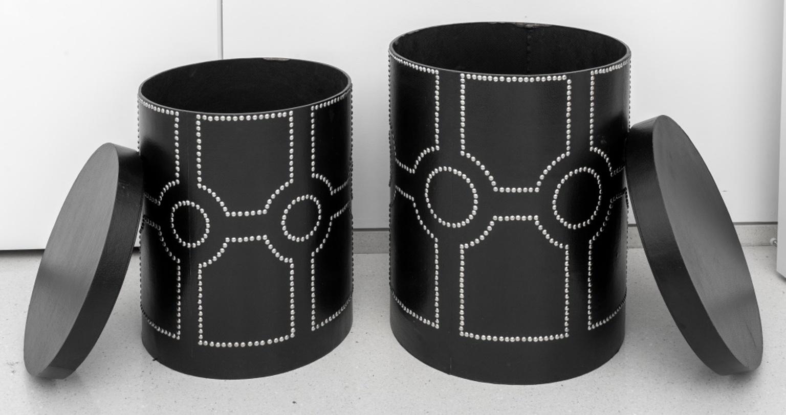 Modern black faux-leather set of two circular nesting end tables or storage boxes, and featuring geometric nailhead motifs on sides. In good condition. Wear consistent with age and use.
Largest: 24