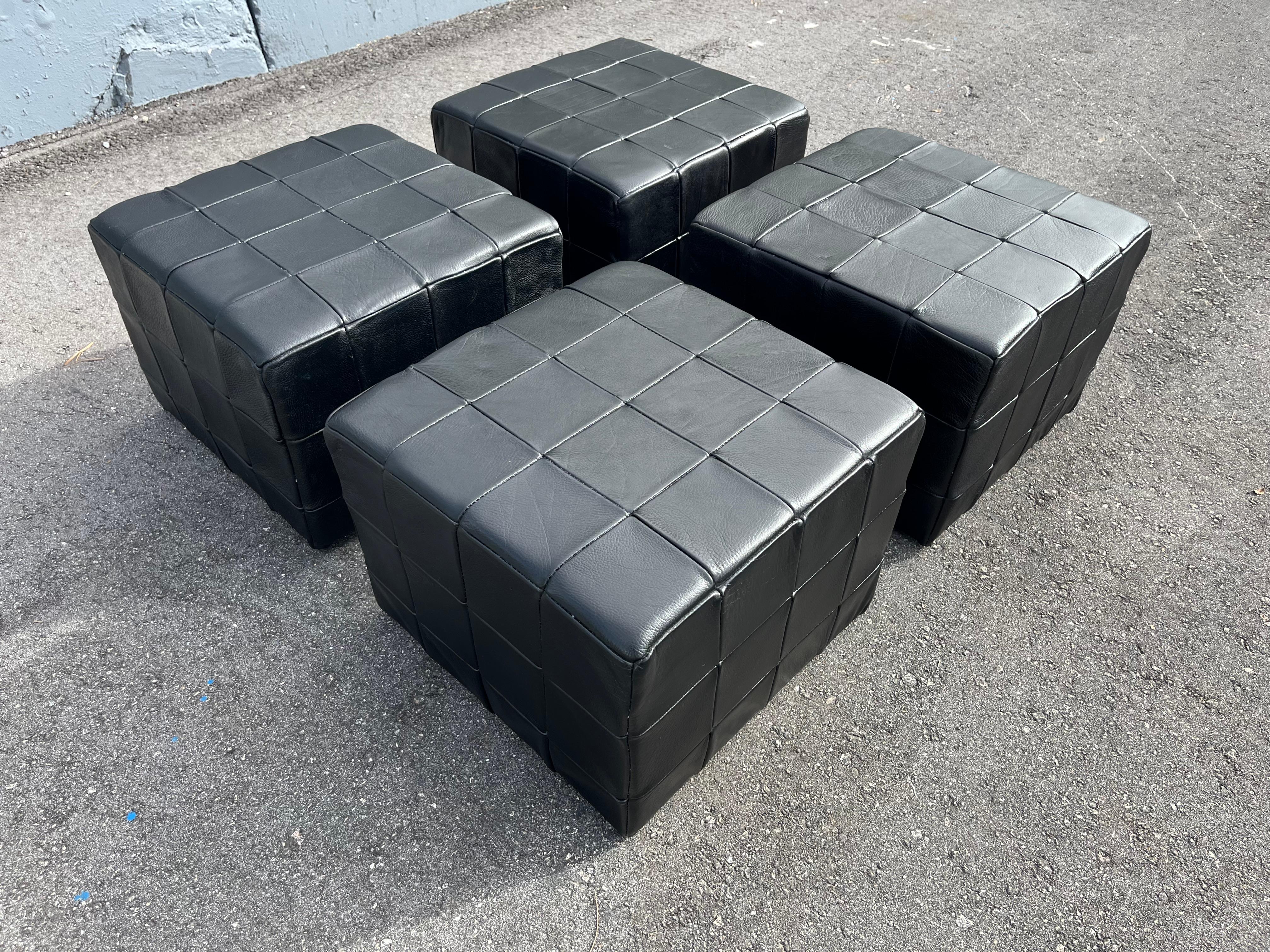Black Leather Patchwork Ottoman made in Denmark. Great as ottoman or side table. 
Price is for one ottoman. In total four available. 