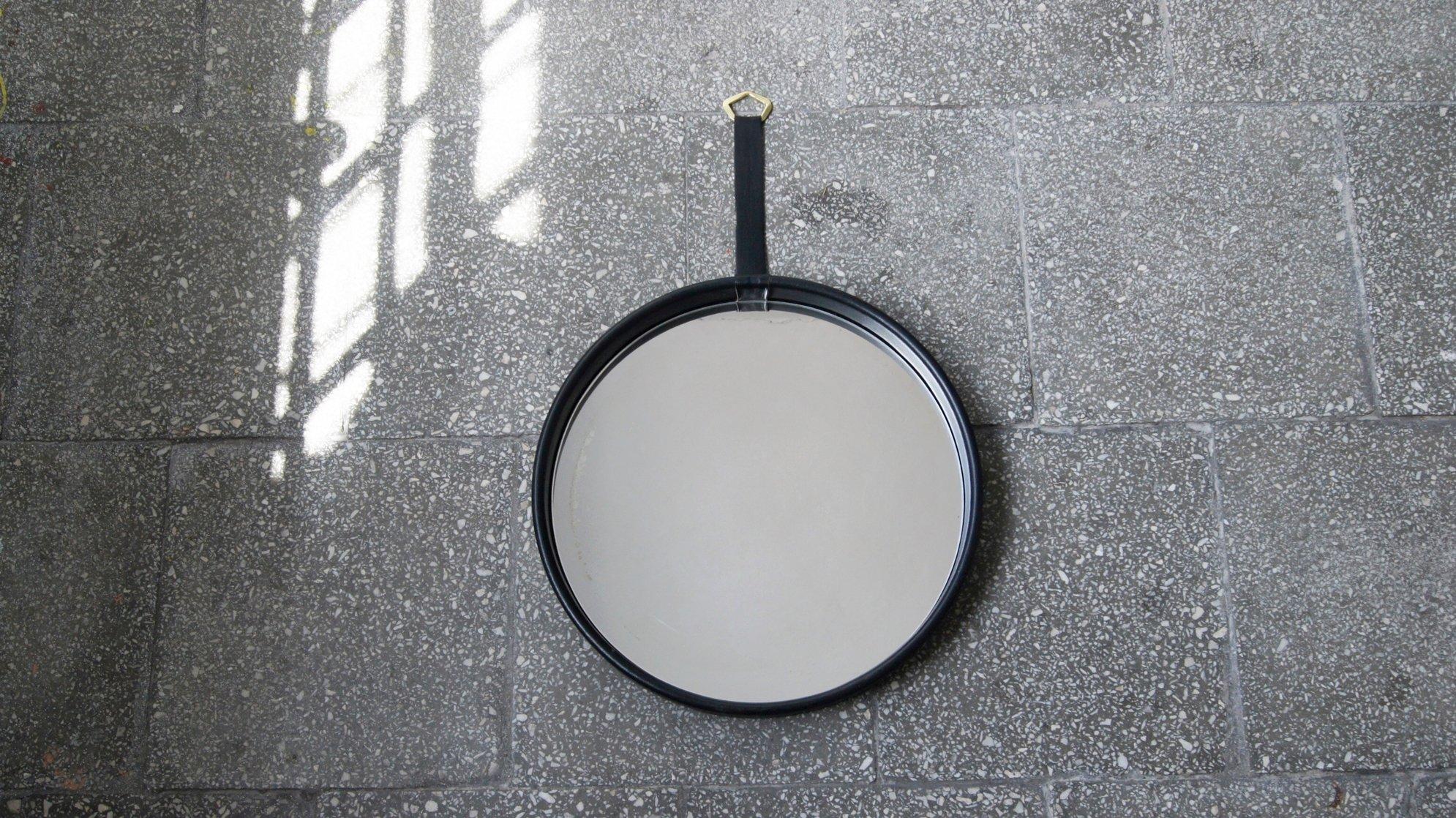 Vintage style round mirror framed in a leather frame - it is both timeless and durable.
The wide frame adds depth.
This mirror will look really elegant on your wall!
Jacques Adnet style design
Adnet was one of the first to integrate metal and glass