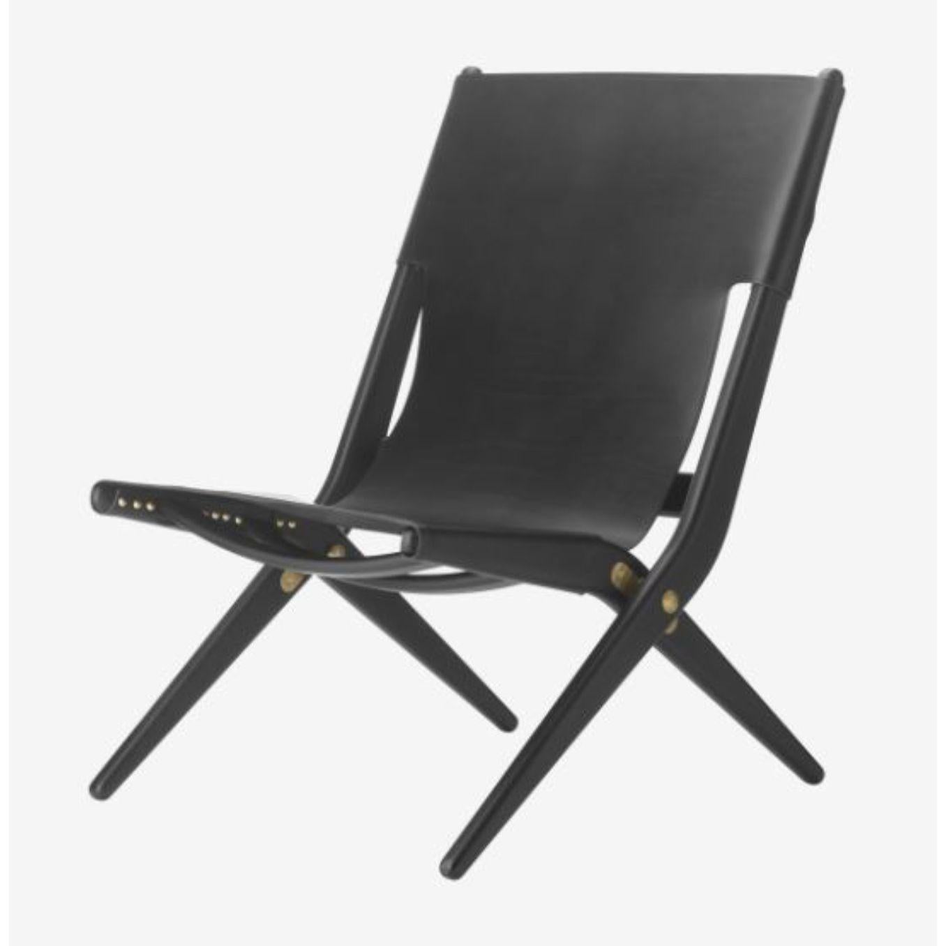 Black leather Saxe chair by Lassen.
Dimensions: D 67 x W 60 x H 84 cm. 
Materials: Leather, Wood, Black Stained Oak.
Also available in different colours and materials.
Weight: 13 Kg

Mogens Lassen was perceived as ‘the naughty boy in class’,