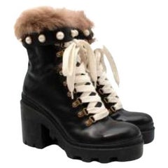 Black leather shearling trimmed combat boots