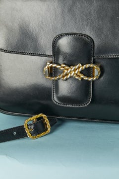 Black leather shoulder bag with gold metal hardware Céline Circa 1970's